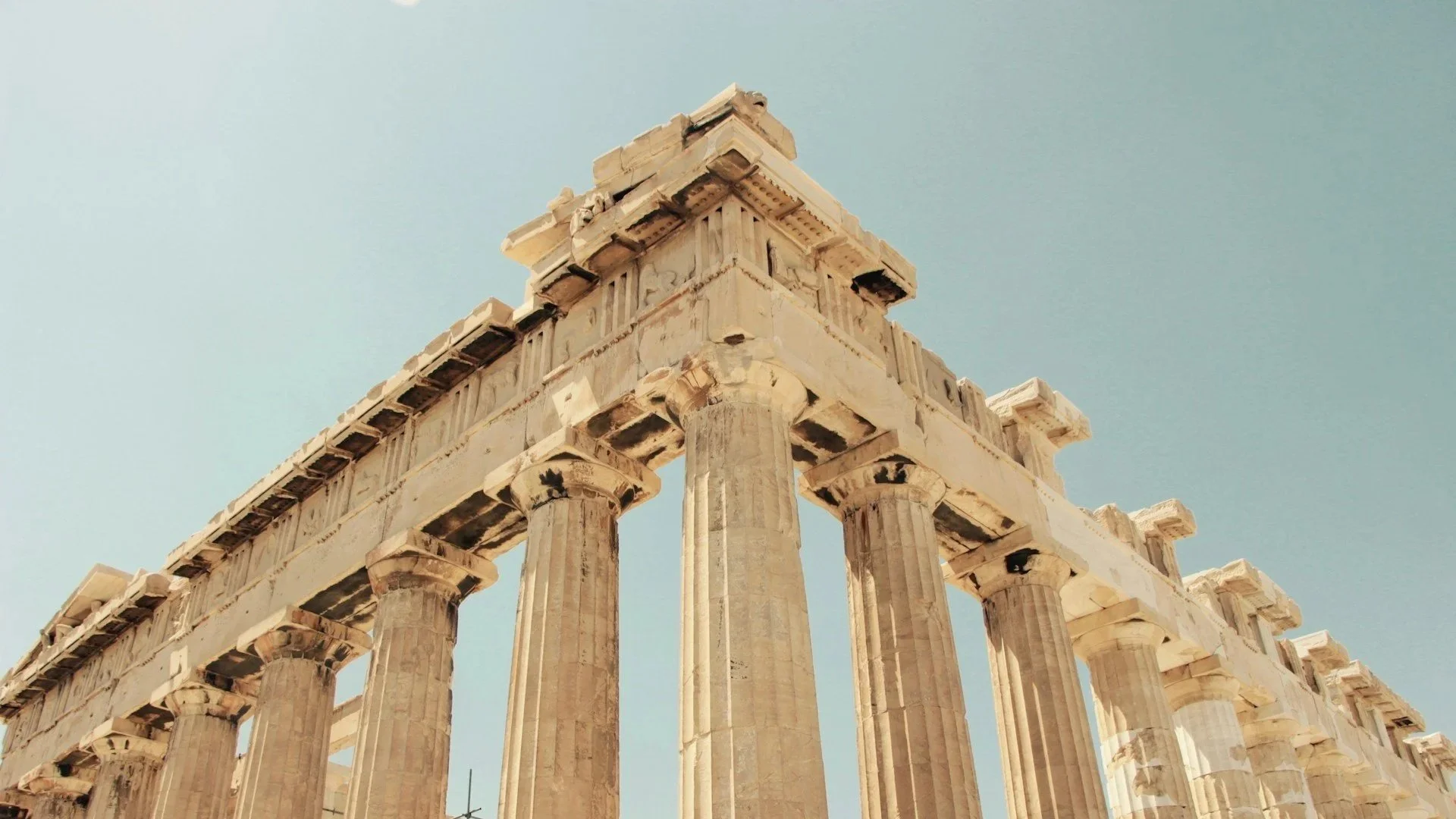 Worm's eye view of the towering Doric columns and structure of the Parthenon in Athens.