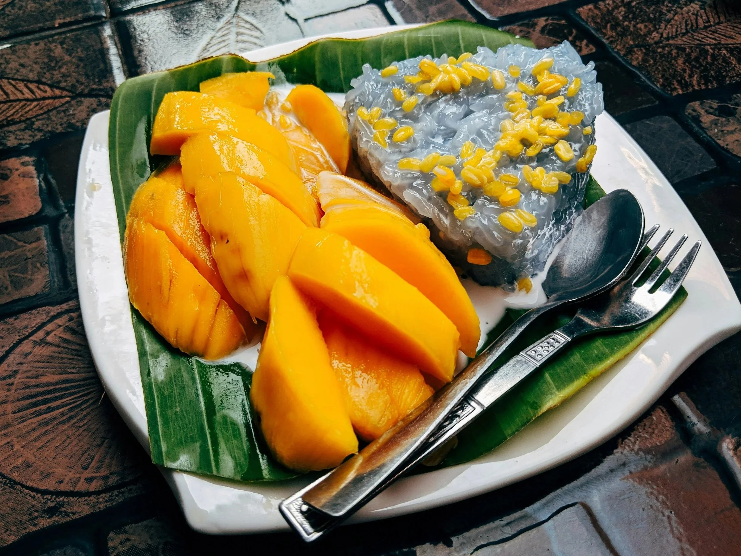 ango sticky rice with purple rice and coconut cream.