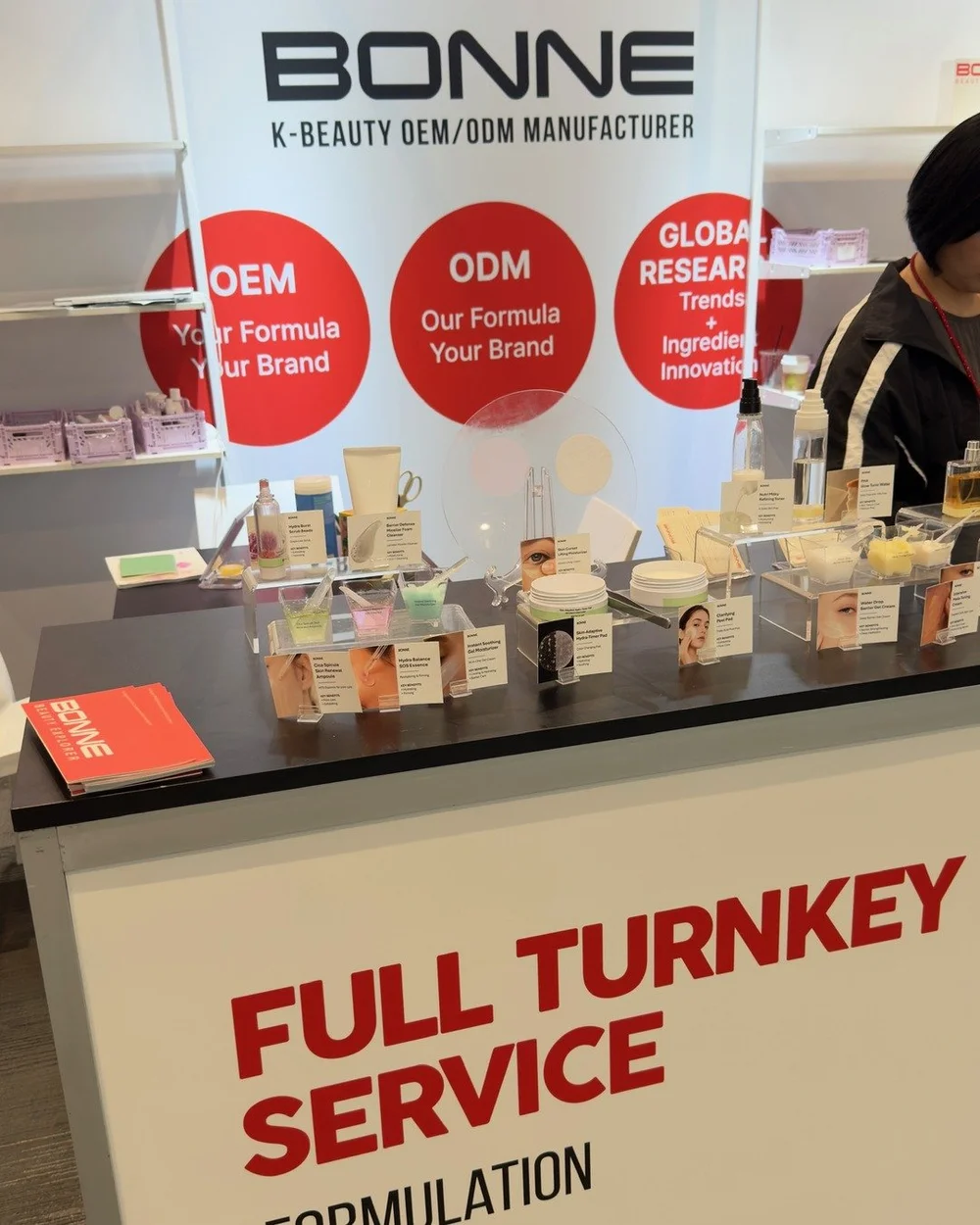 Full turnkey service on the front panel of the stand, not inside the brochure.