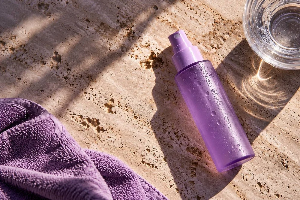 Hypochlorous acid spray bottle on a travertine surface