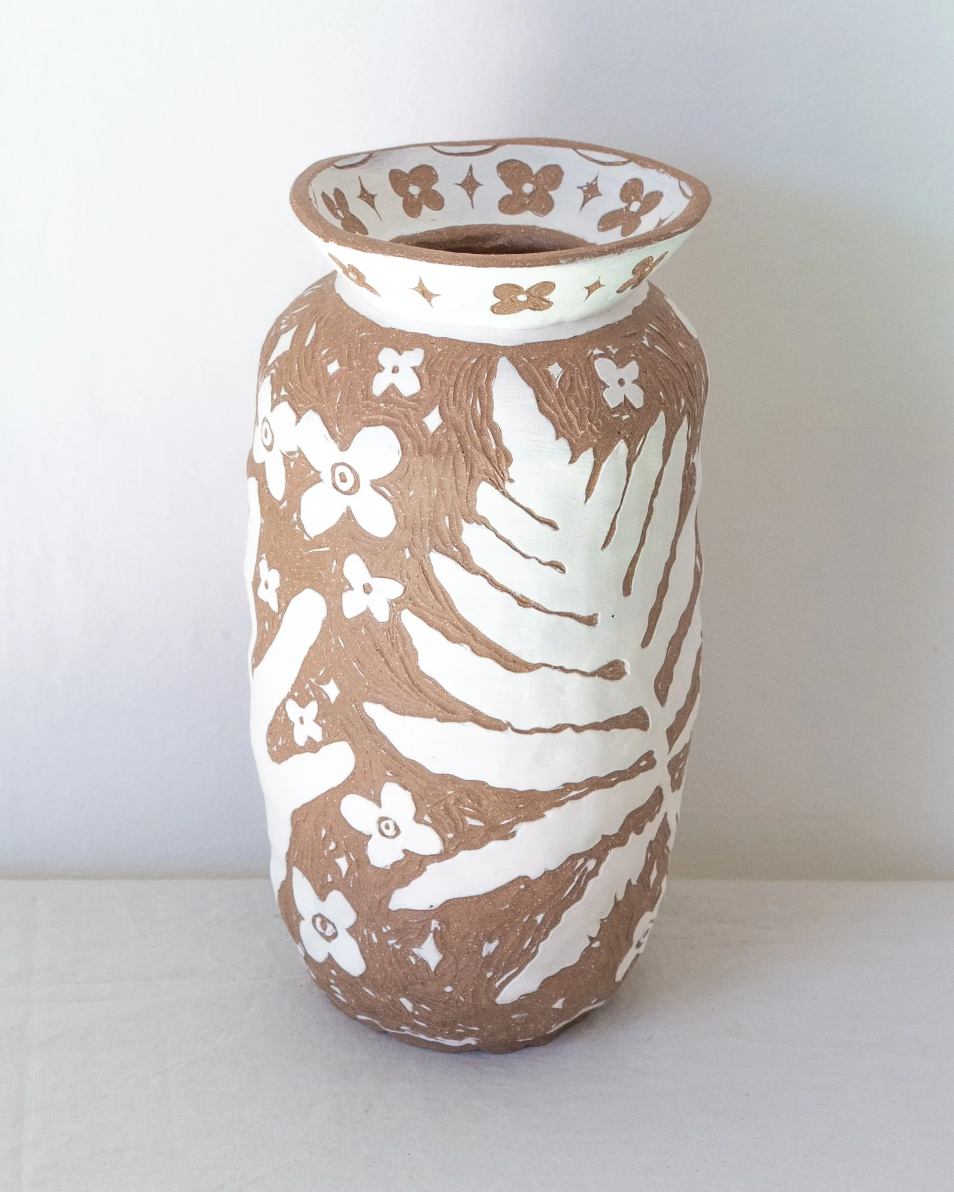 Vessel (Sensitive ferns, my hands, and ancient flowers)