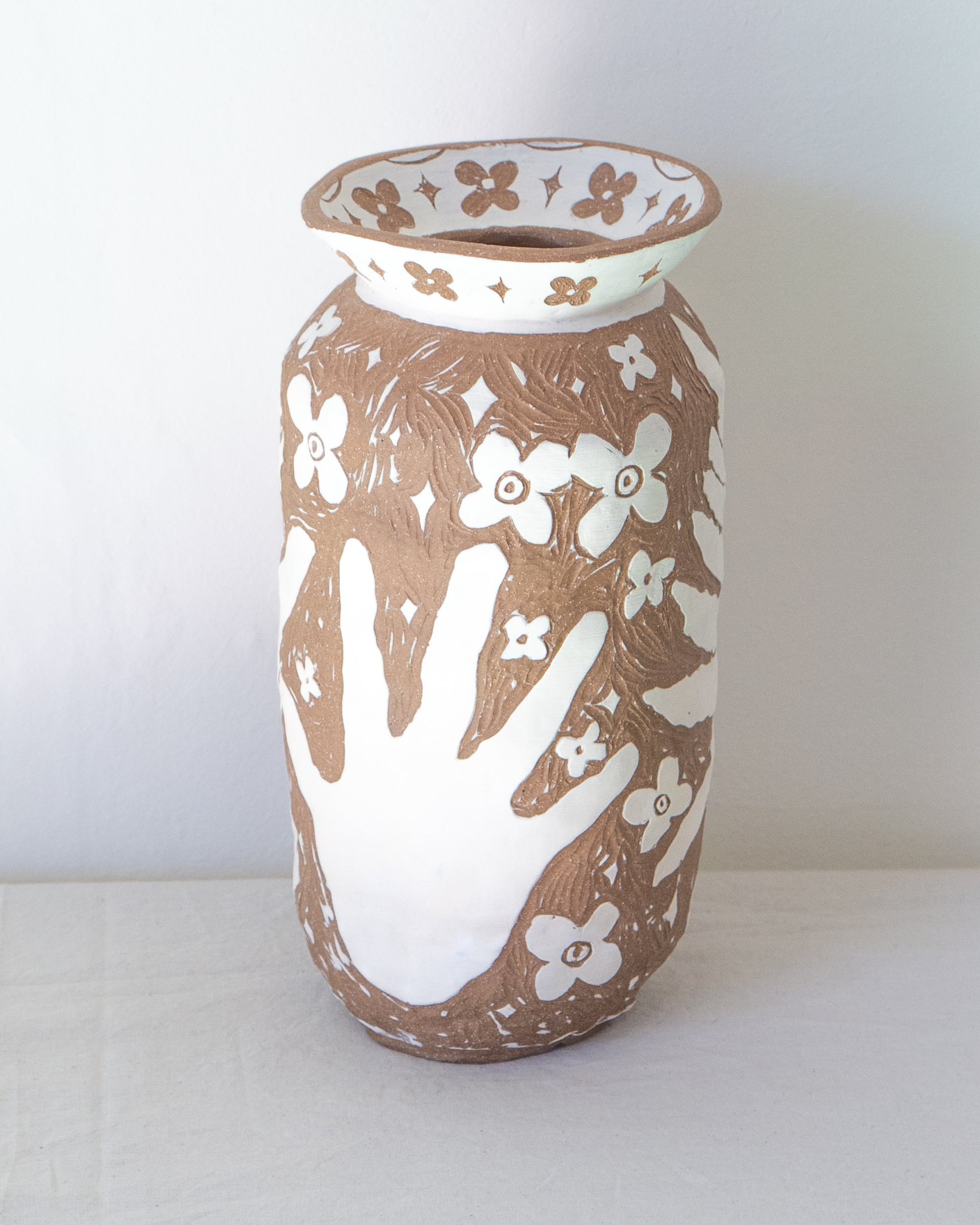 Vessel (Sensitive ferns, my hands, and ancient flowers)