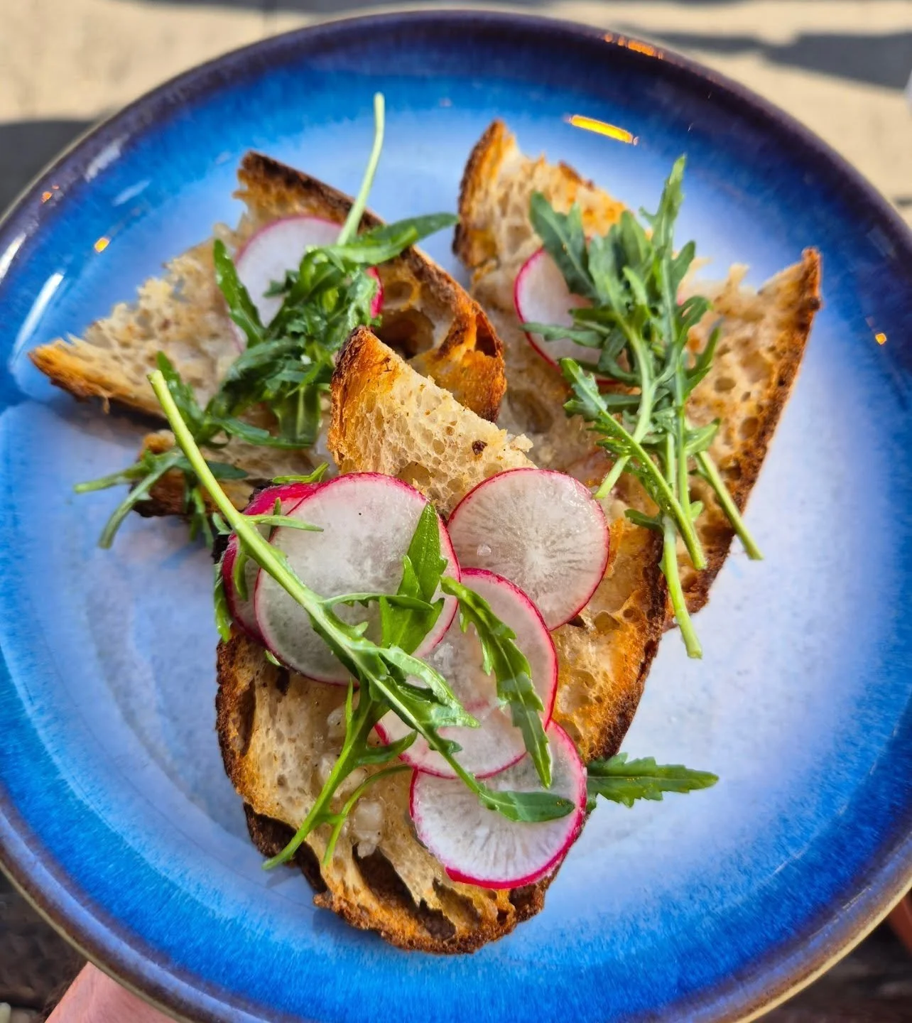 Bone marrow on sourdough, radish &amp; rocket.