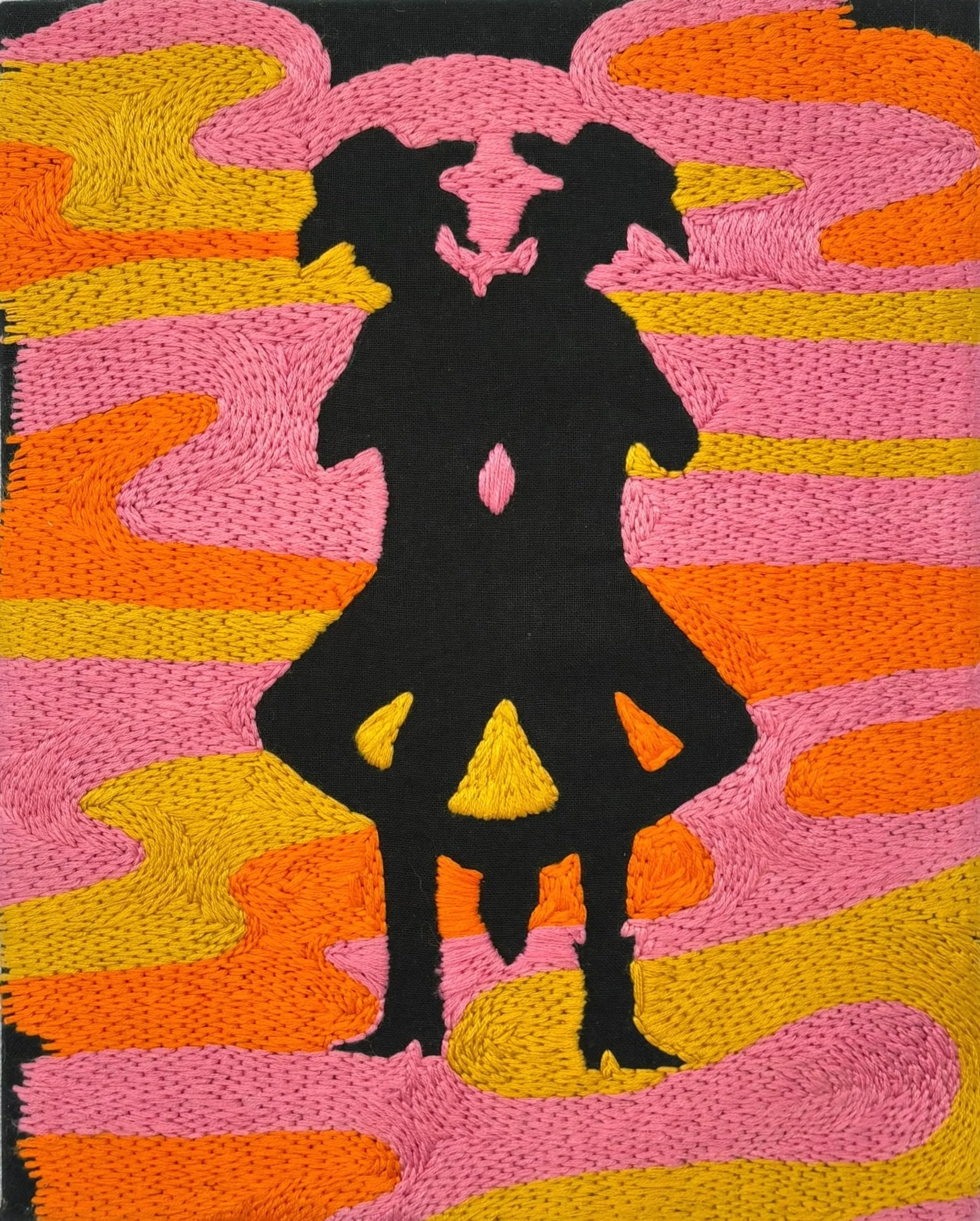 Two cowgirl silhouettes standing back to back with a hand stitched embroidery background of bright swirling colors in pink, orange, and yellow made by Hannah Kennedy.