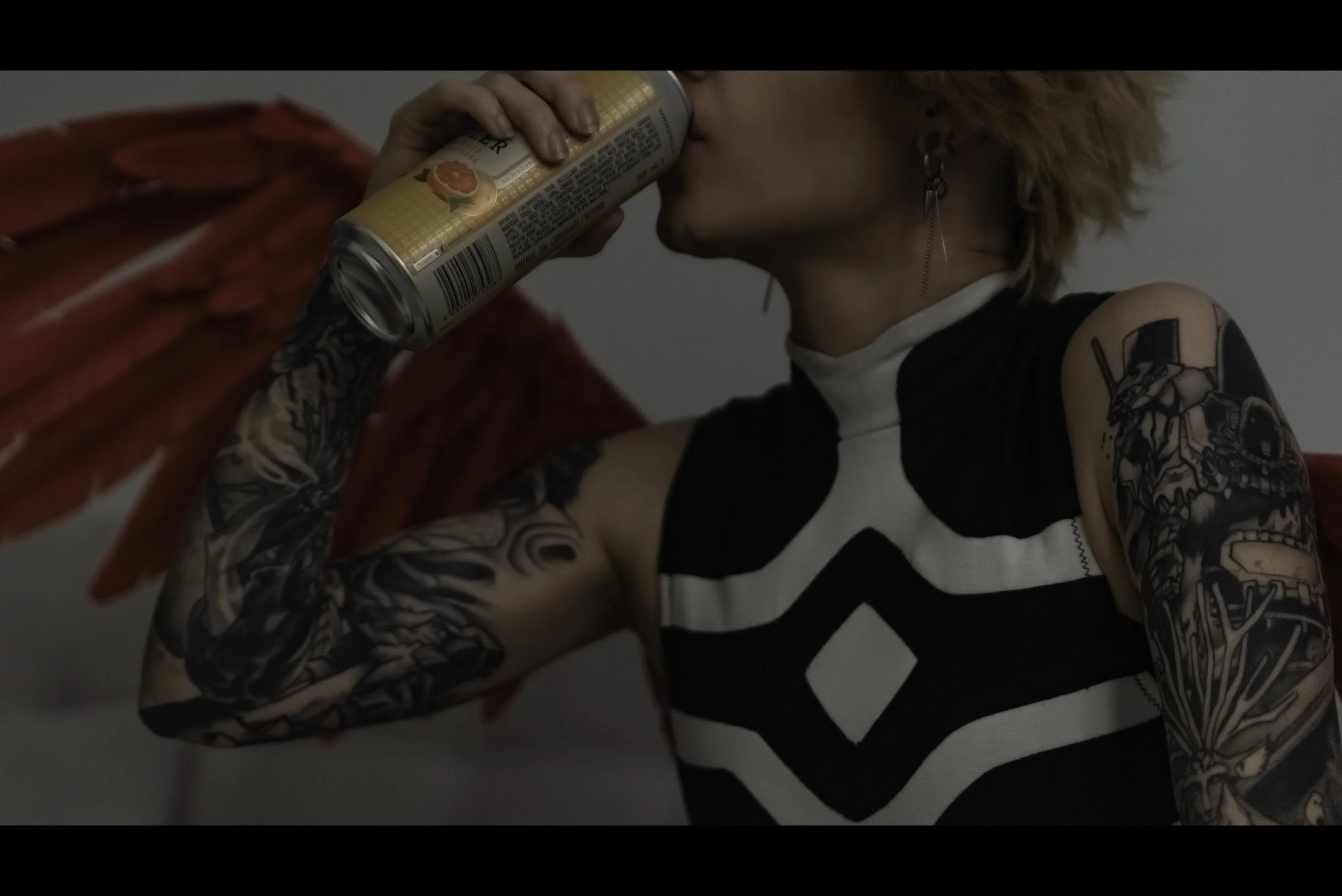 Hawks drinks from the can.