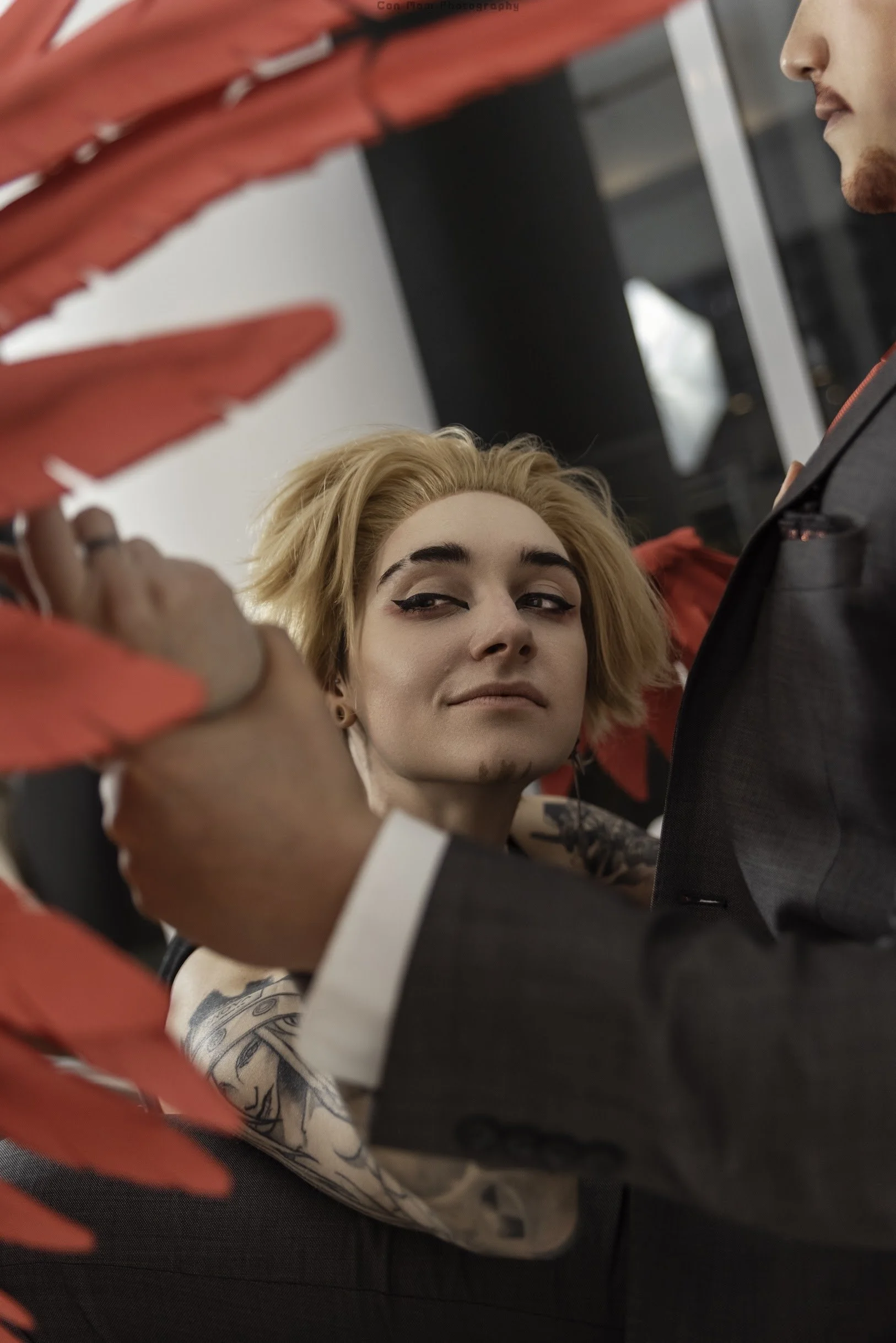 Hawks glancing over at his wrist, dwarfed in the other man's much larger hand, His expression makes it clear he approves.