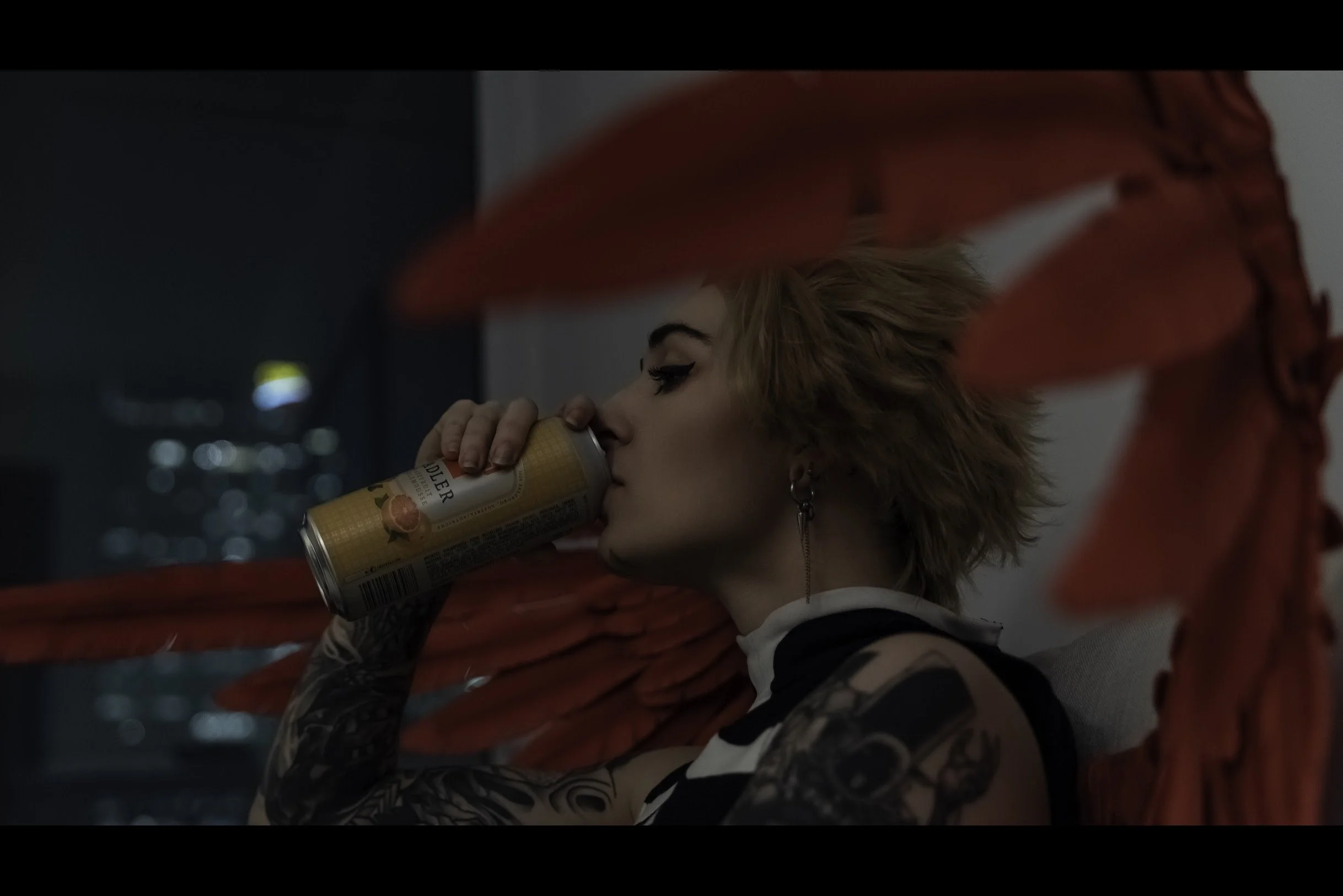 Still drinking, the can tilted higher. 