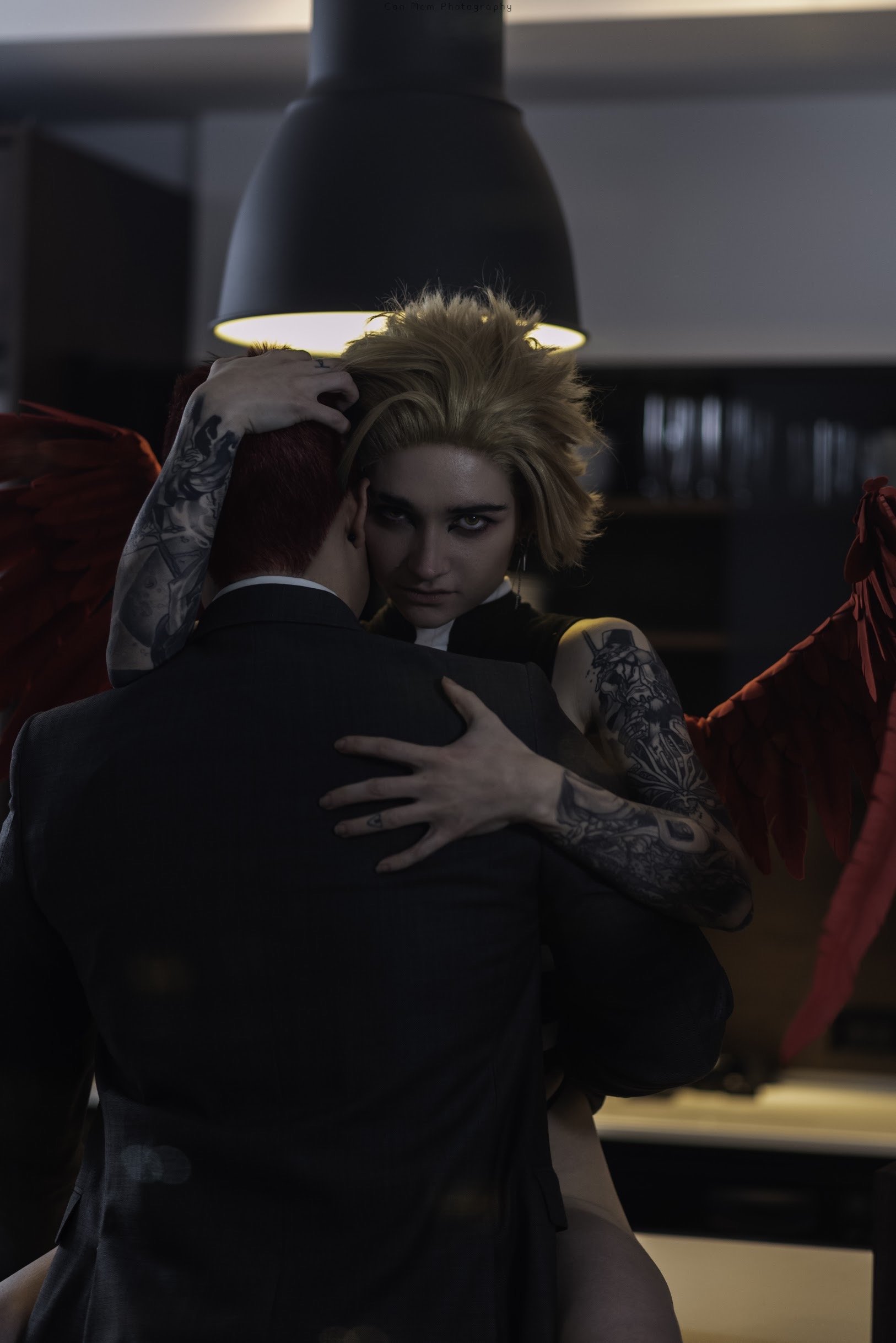 Another view of Hawks on the counter, arms around Endeavor.