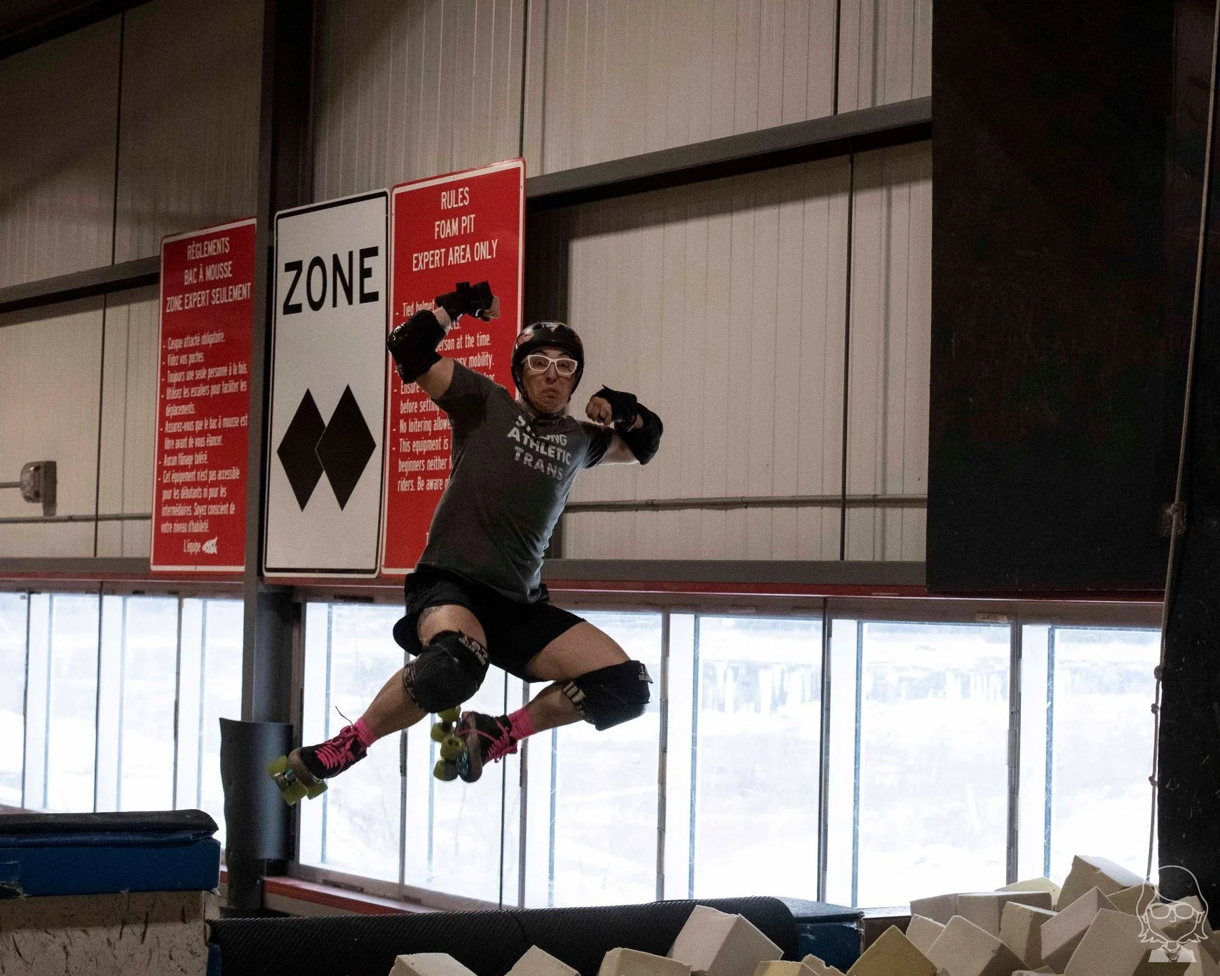 roller skater mid air on mega ramp foam pit jump