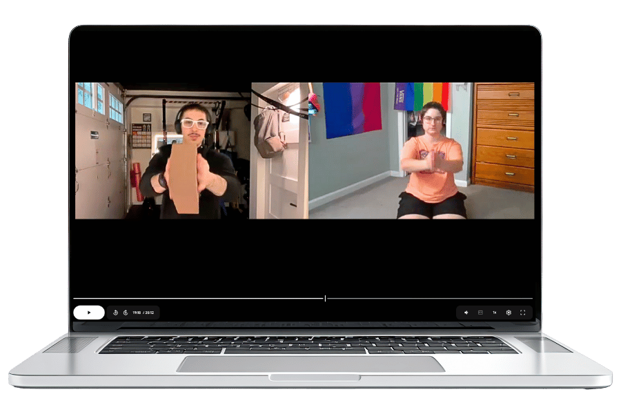 A laptop screen is split in half. On one side, Dibs demonstrates how to use an exercise block. On the other side, their client follows along with the movements.
