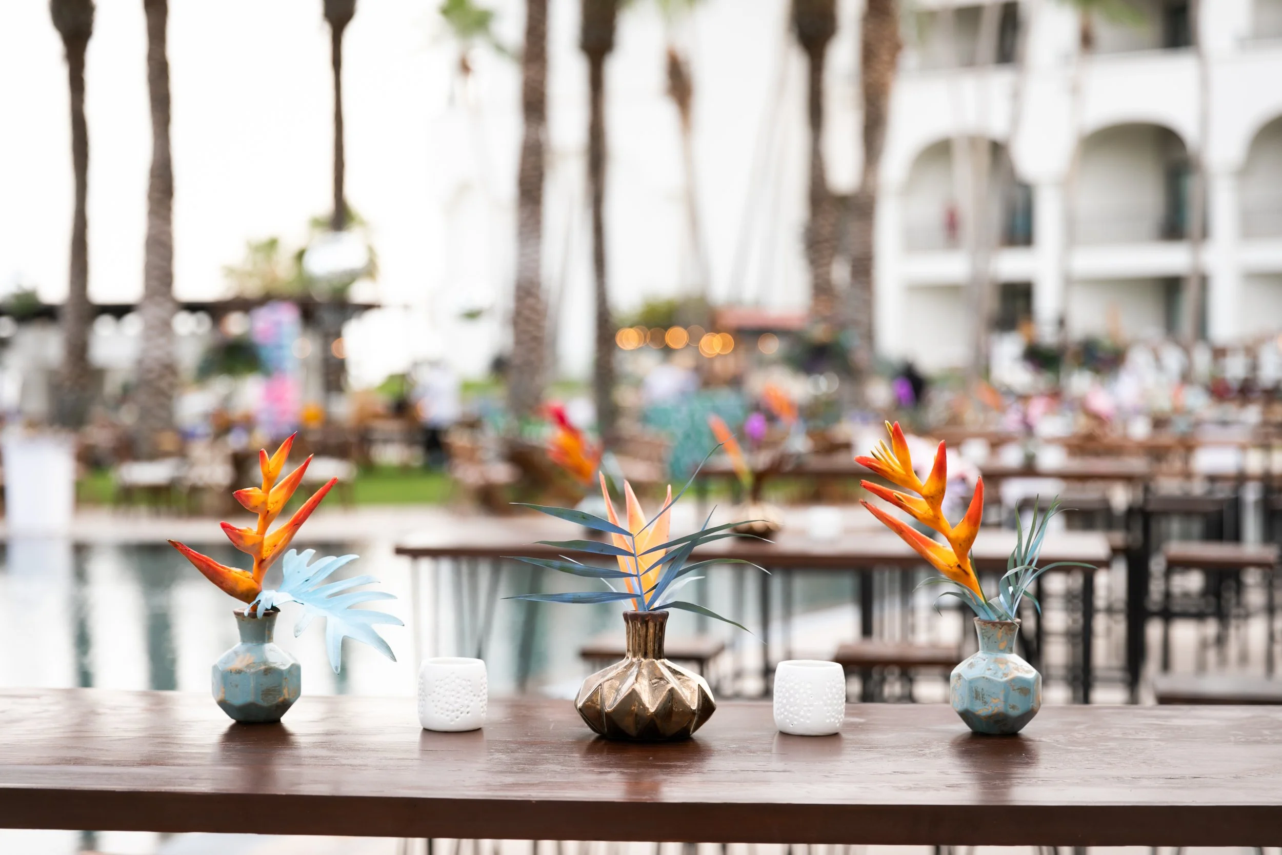 Jungle disco pool party centerpieces for grand finale celebration.