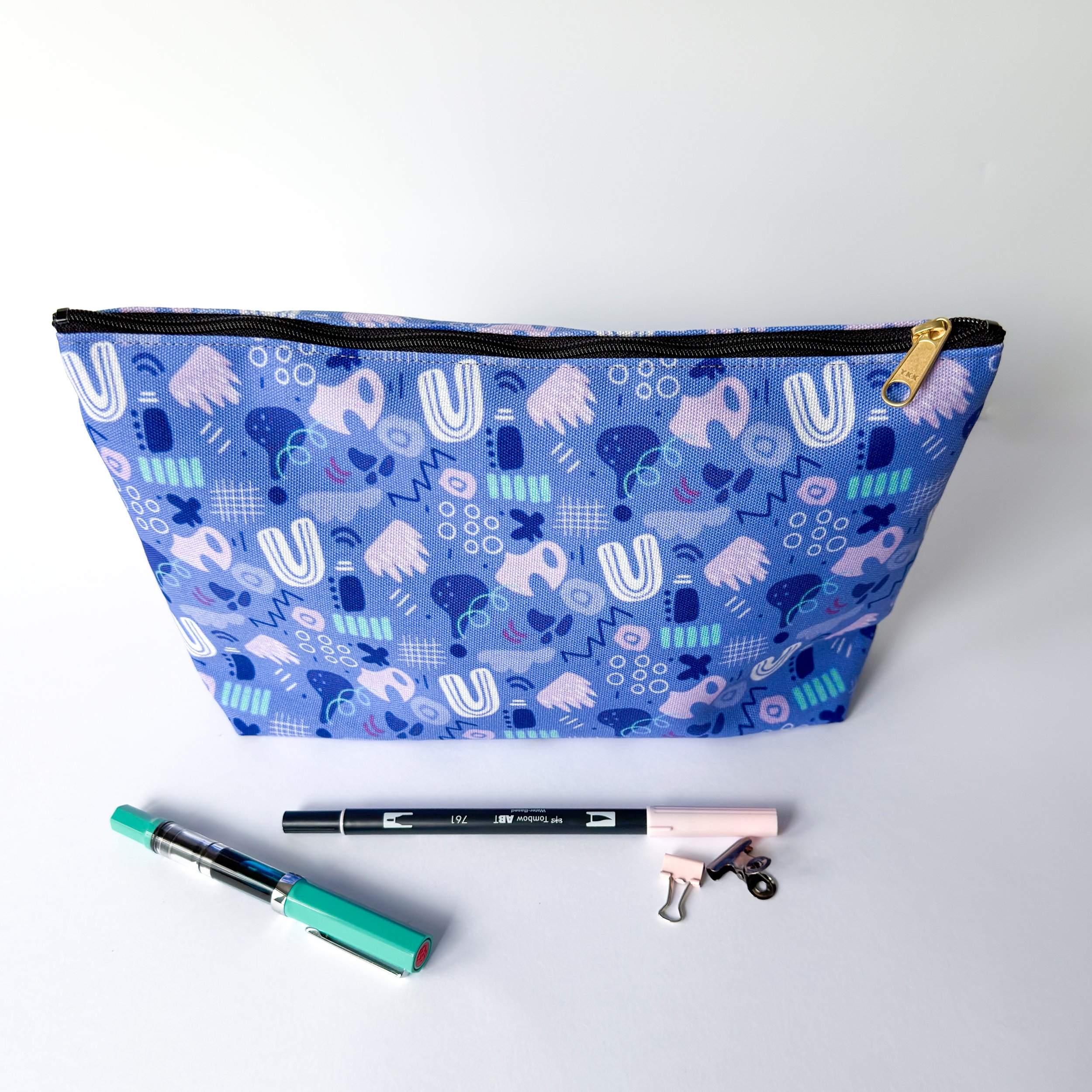 abstract shapes and lines pattern in a fabric pouch perfect for gifting, traveling and as a pencil case