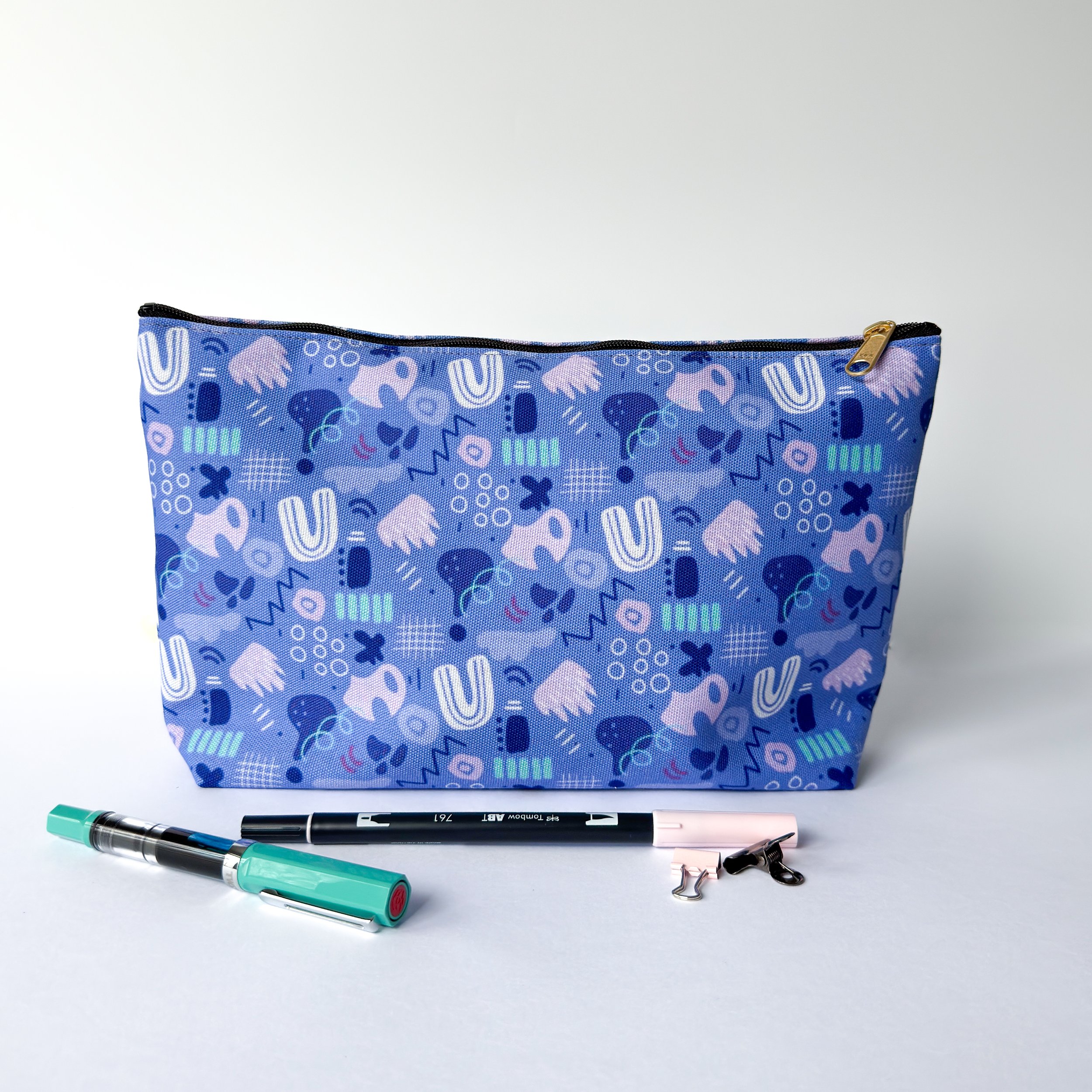 abstract shapes and lines pattern in a fabric pouch perfect for gifting, traveling and as a pencil case