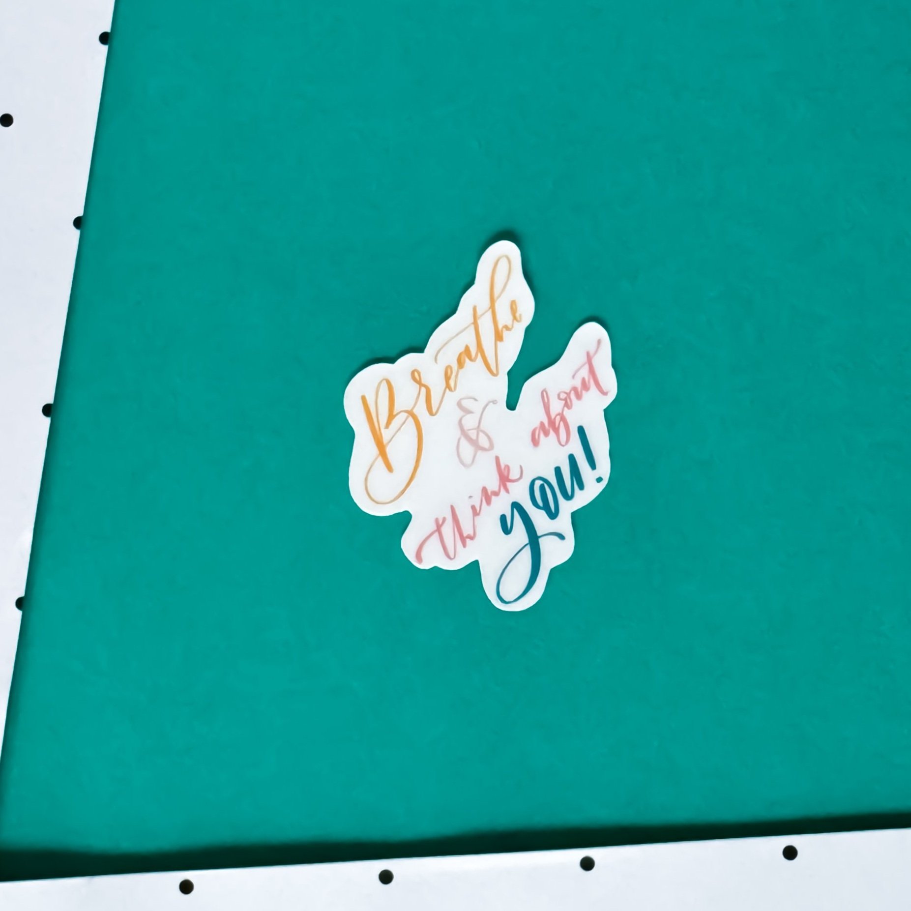 lettering sticker with uplifting quote breathe and think of you