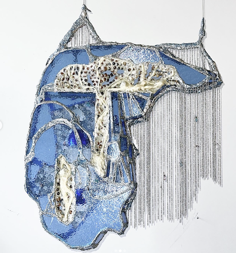 Mixed media artwork featuring a whale with abstract elements and textured details in blue and white tones.