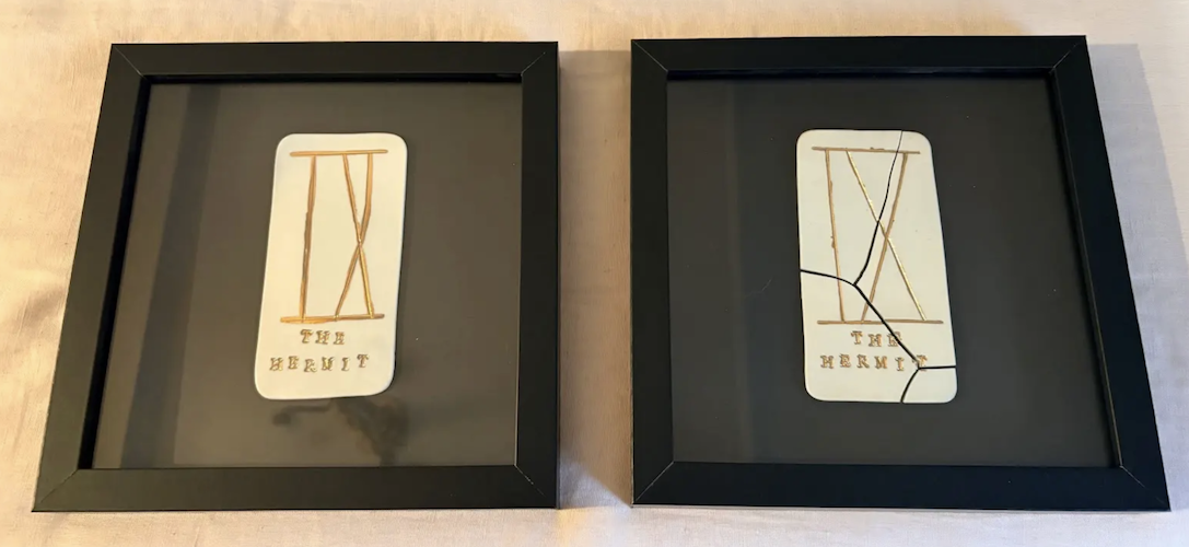 Two framed pieces of art with geometrical designs made of sticks, labeled 'The Bent' and 'The Hermit'.
