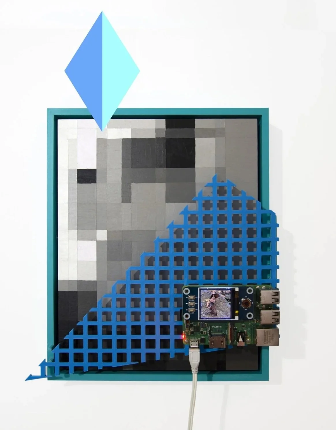 A pixelated black, white, and gray image behind a blue wire grid with a small screen showing a person playing in a stream, a Raspberry Pi, a blue diamond-shaped object, and a blue grid structure.