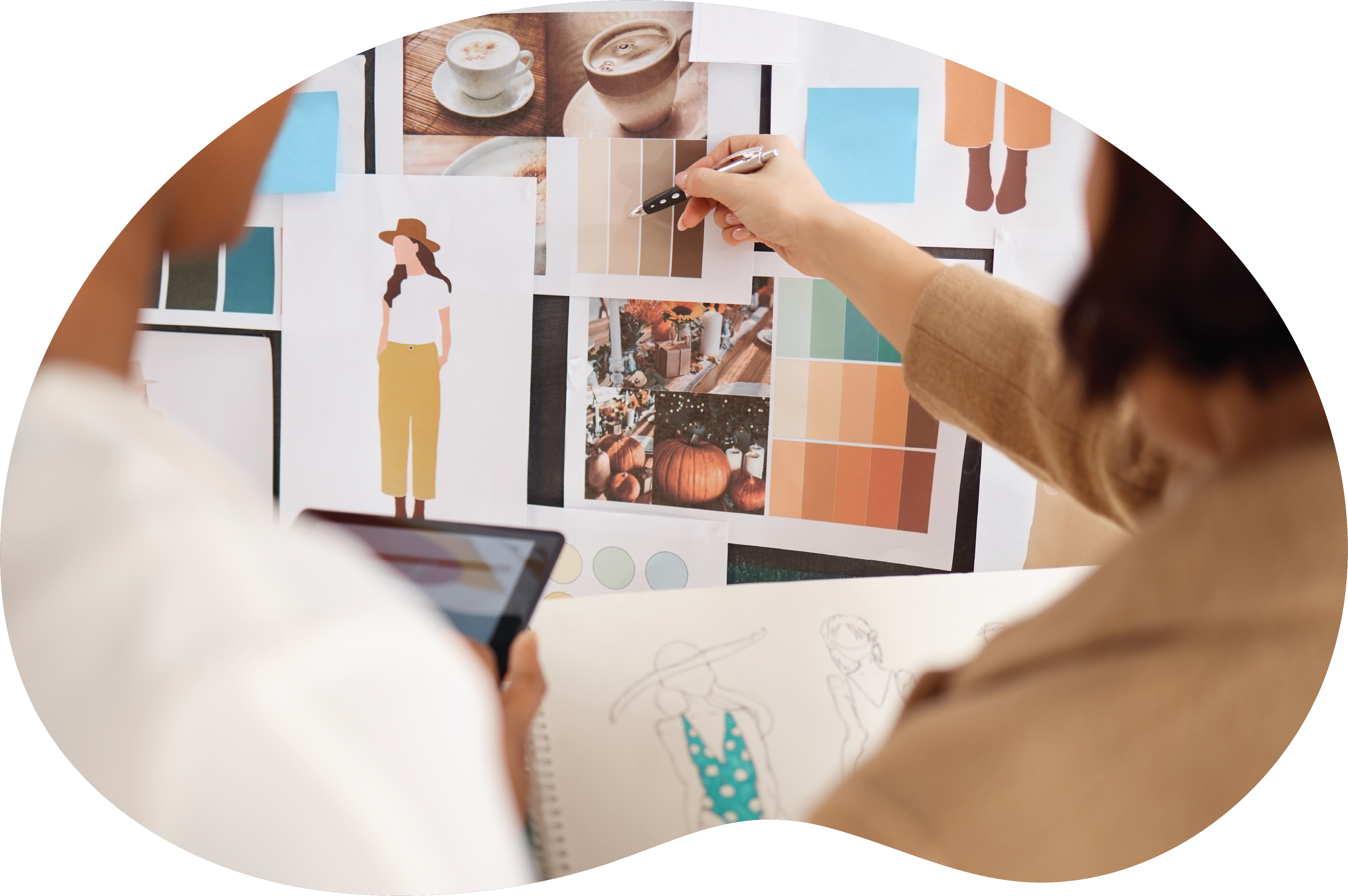 Creative team reviewing a brand mood board with photography, color swatches, and visual inspiration.