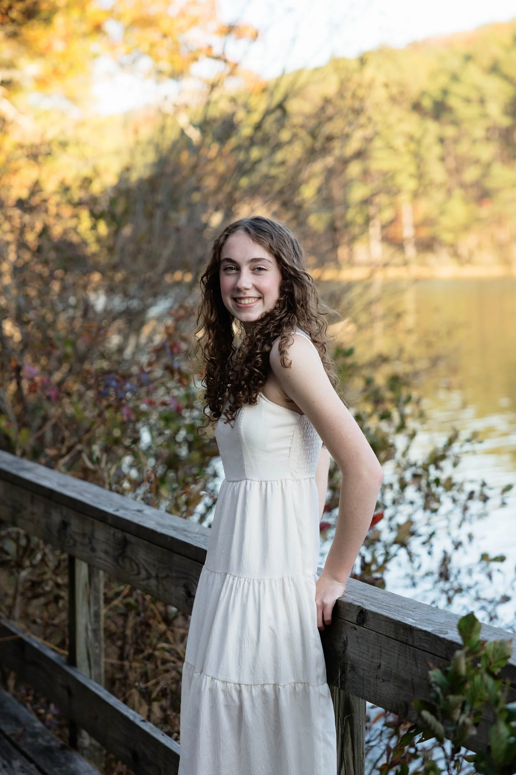 christian summer camp counselor smiling in field