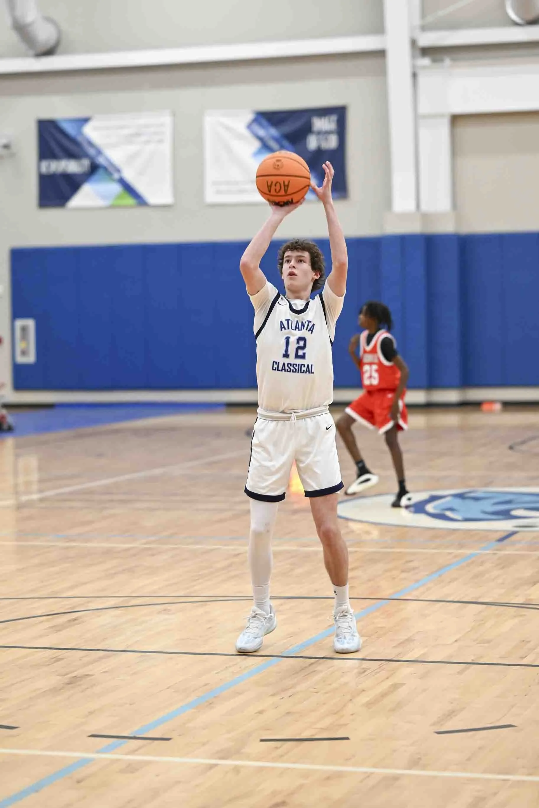 christian summer camp counselor playing basketball