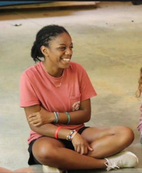 christian summer camp counselor smilng