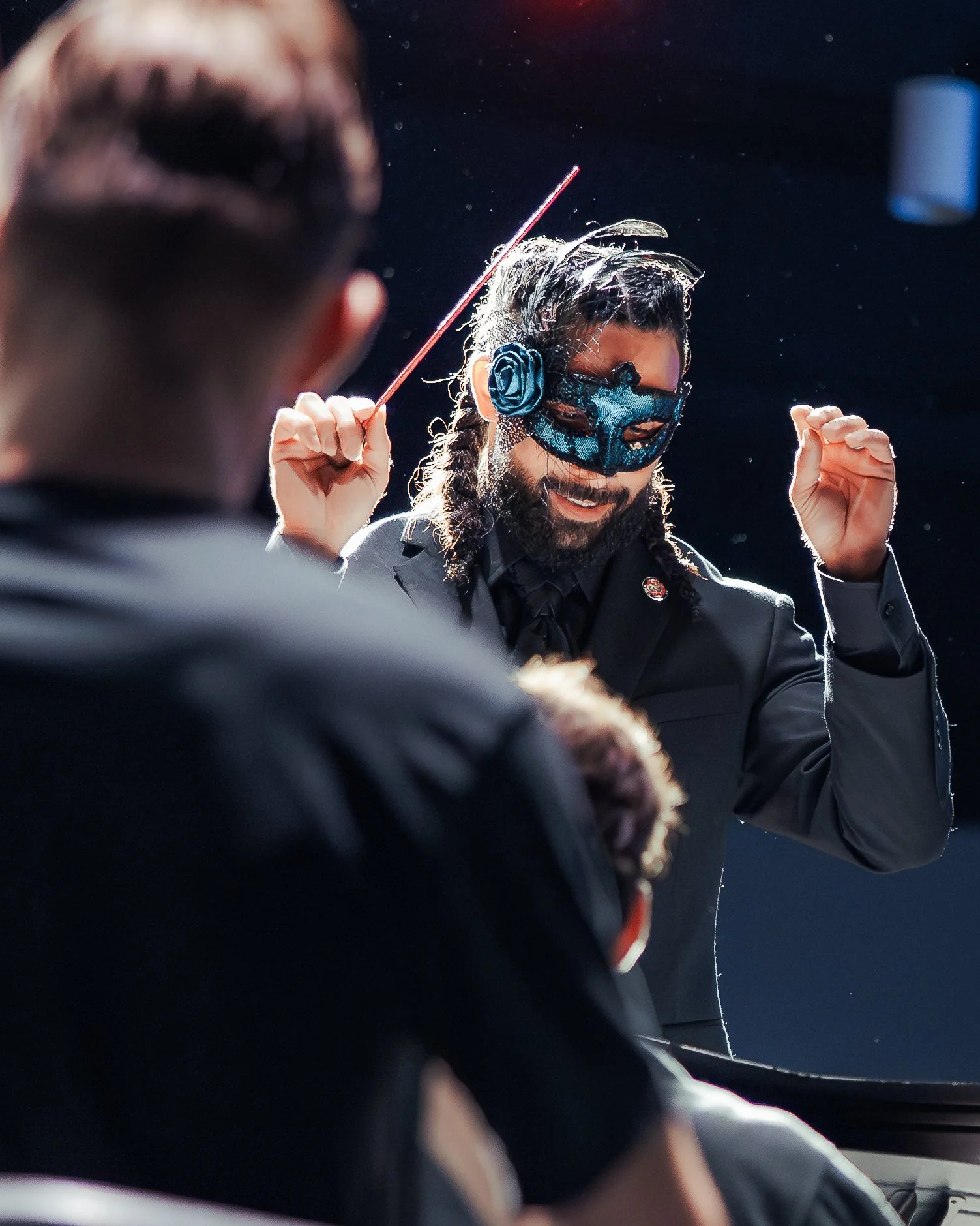 A masked conductor leads musicians at Richlands High School’s Halloween concert.