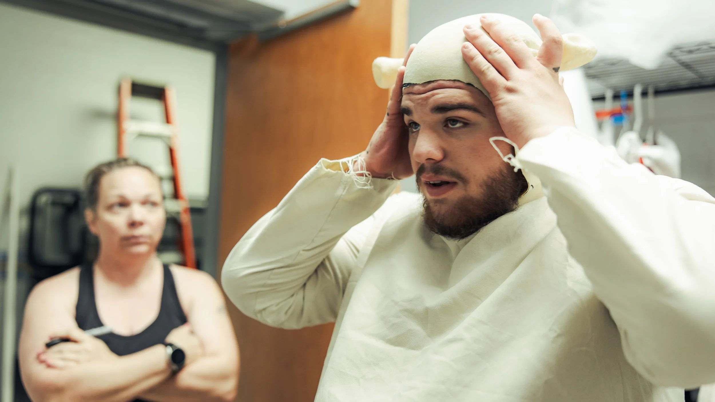 Trying on Shrek’s headpiece backstage.