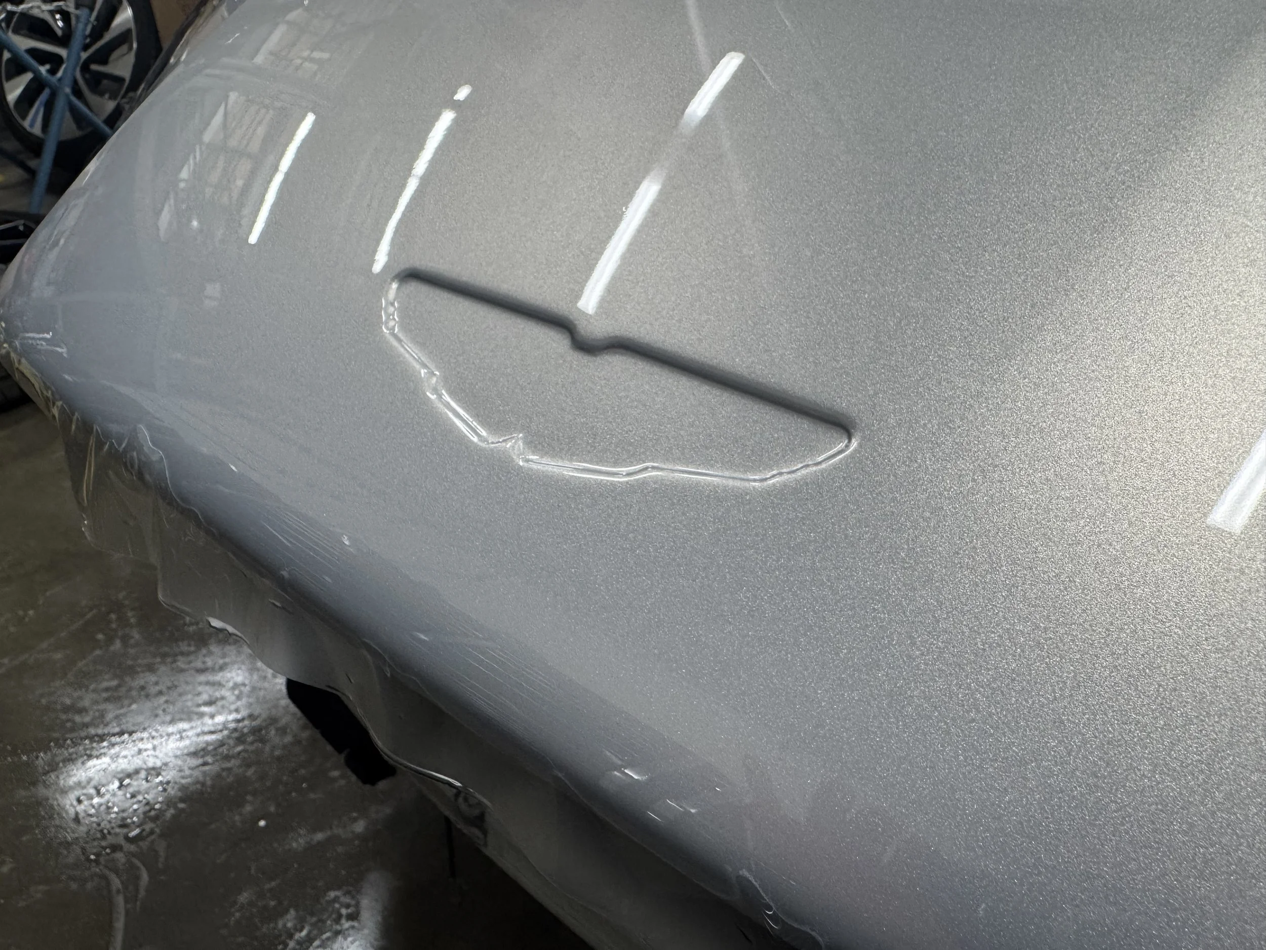 Aston Martin DB12 Volante Hood Badge.jpg