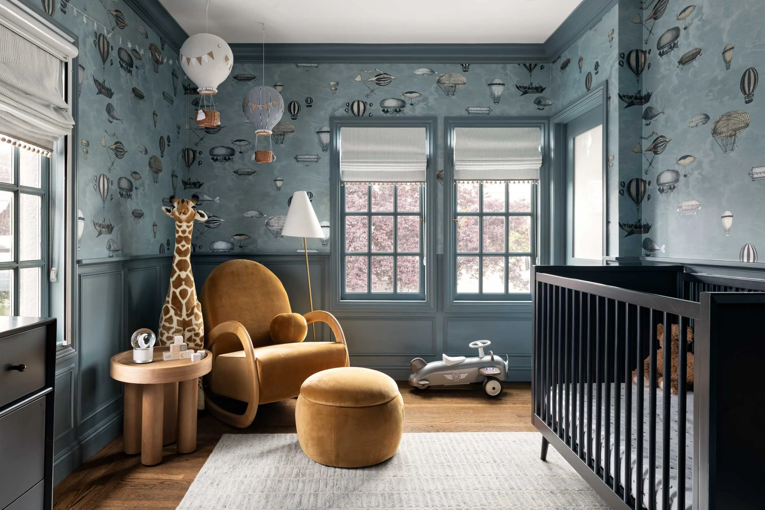 Baby blue sweet nursery designed with whimsical charm and functionality.
