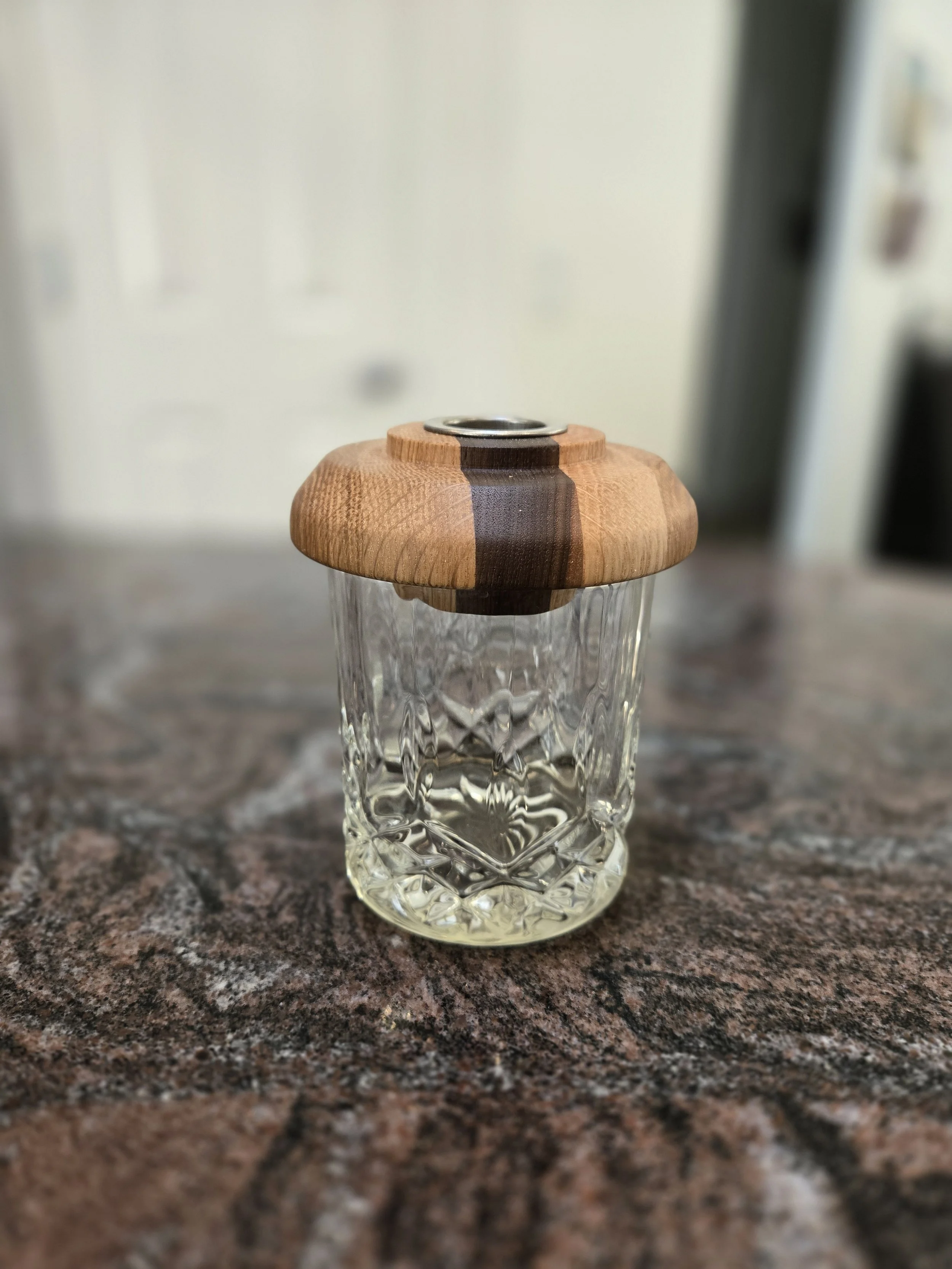 Crafted primarily from solid white oak with a contrasting walnut accent, this cocktail smoker blends durability with refined detail. White oak provides strength and tradition, while walnut adds warmth and visual contrast. Lathe-turned for a precise f