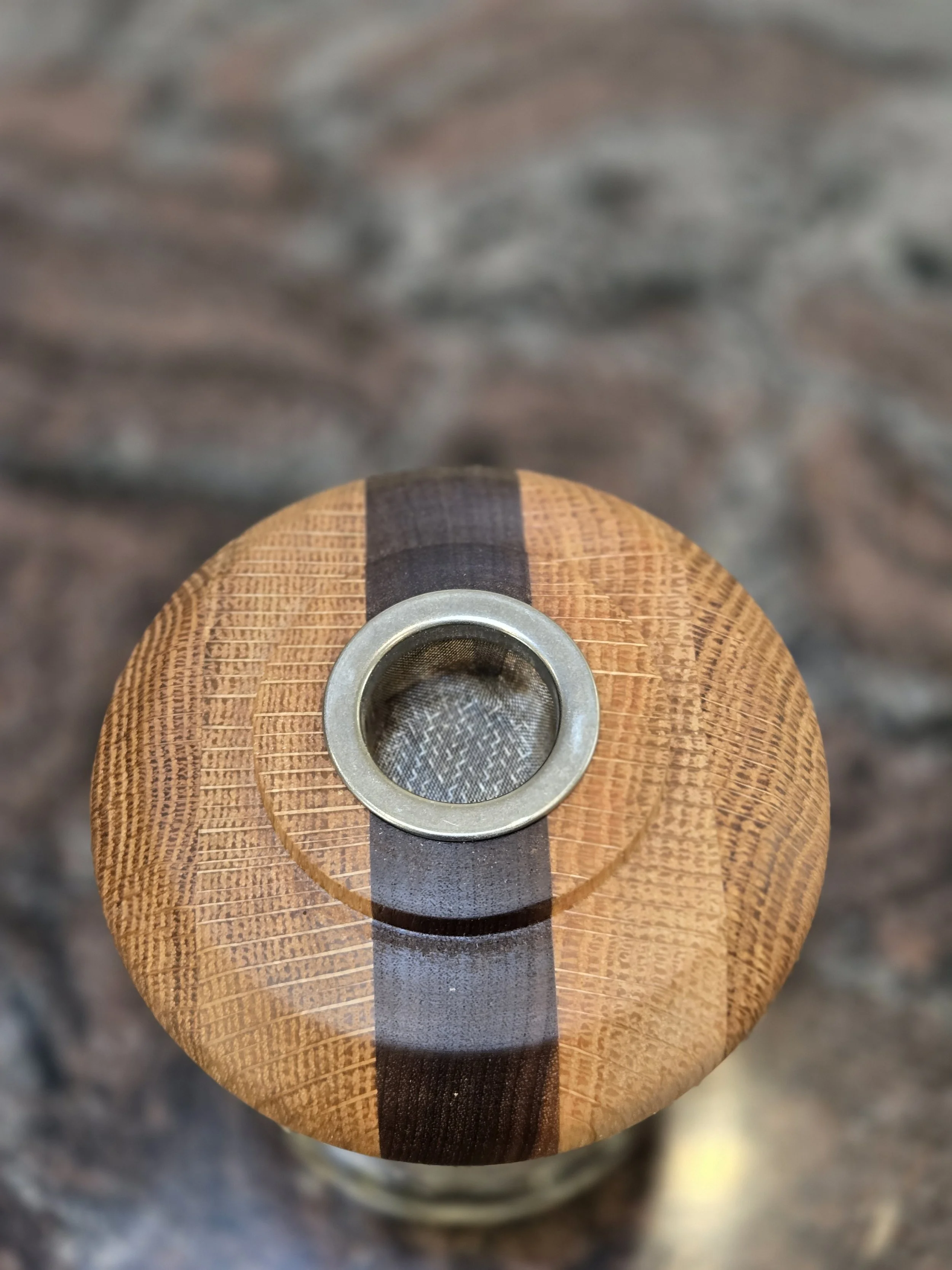 Crafted primarily from solid white oak with a contrasting walnut accent, this cocktail smoker blends durability with refined detail. White oak provides strength and tradition, while walnut adds warmth and visual contrast. Lathe-turned for a precise f