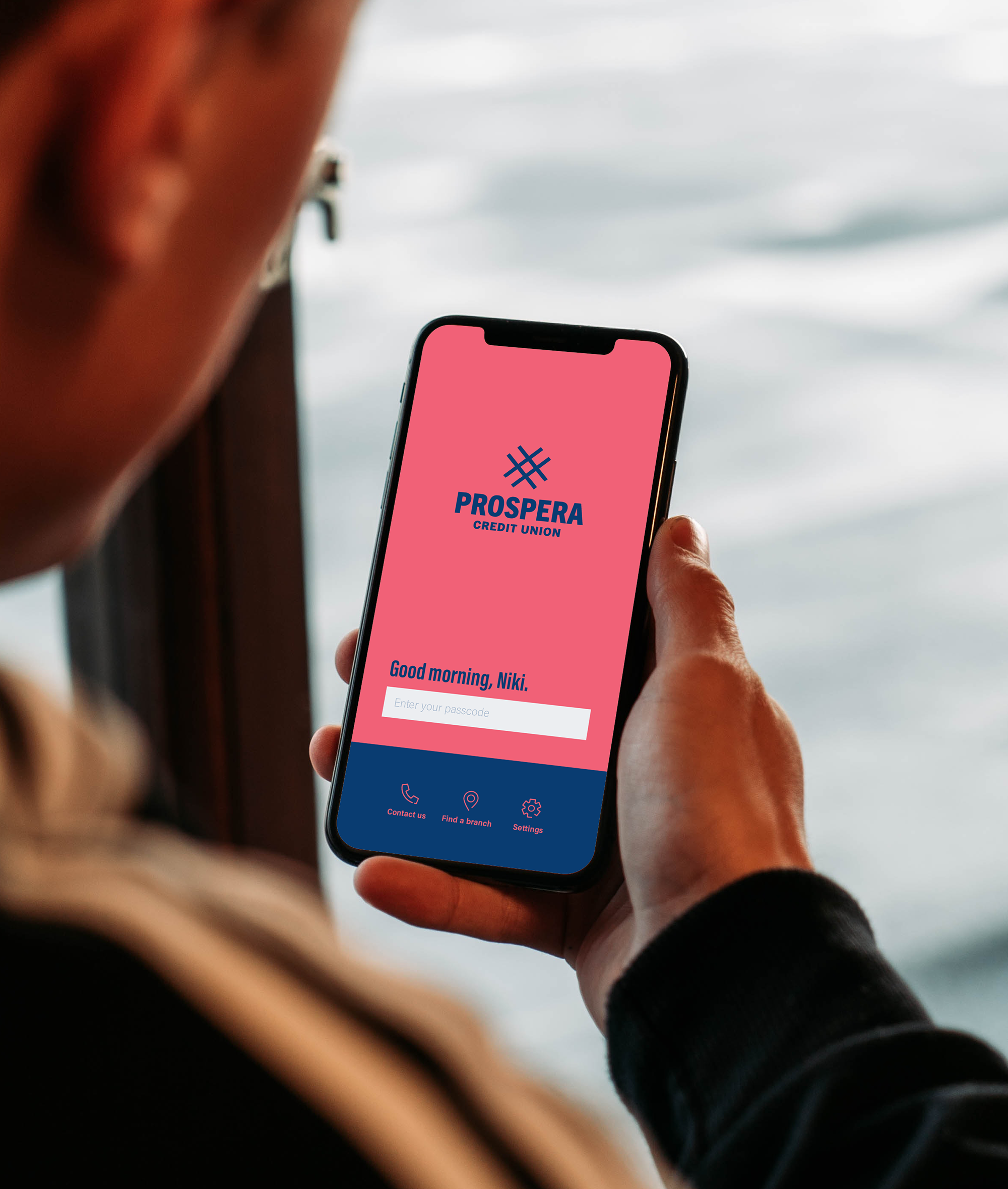 Man Holding iPhone Mockup.png