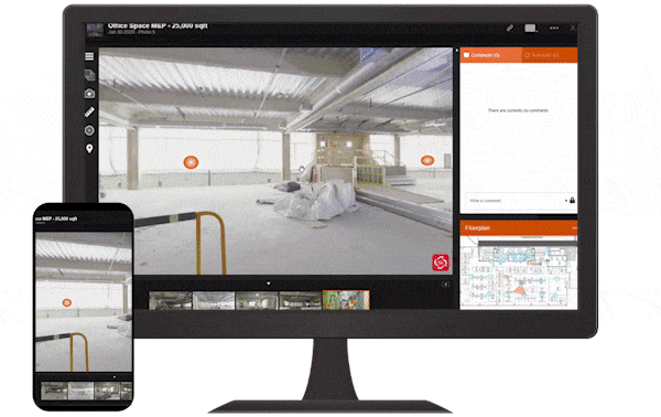 A computer monitor and smartphone showing a security camera feed of an indoor parking garage. The scene includes parked cars, yellow safety barriers, and orange social distancing signs.