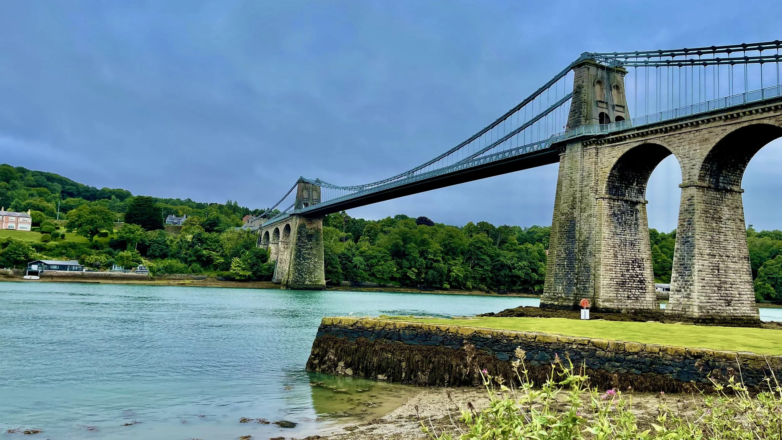 Taxi from Bangor Railway Station to Menai Bridge town across the Menai Suspension Bridge in North Wales
