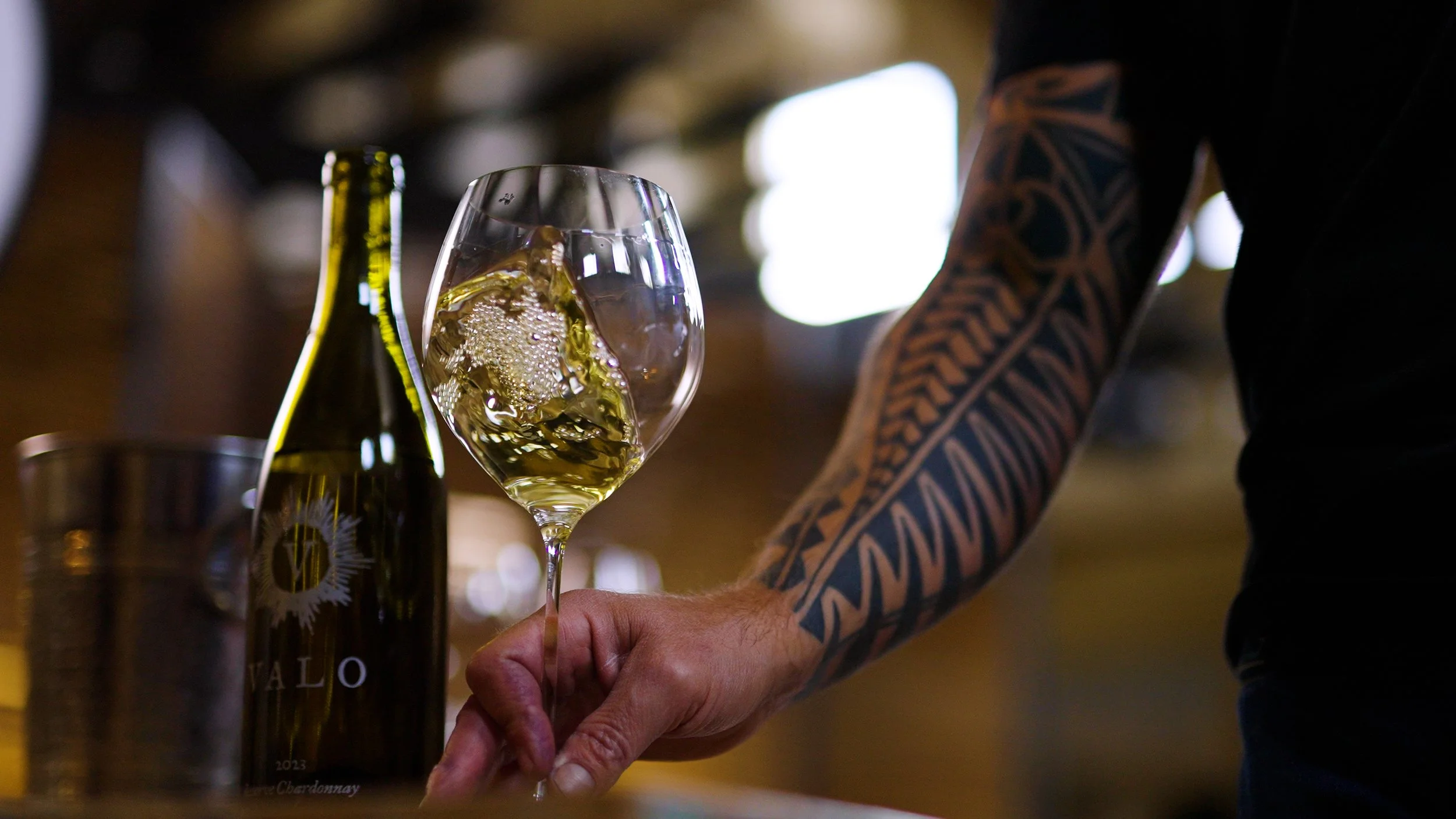 Valo winemaker, Matias Kusulas, swirling chardonnay