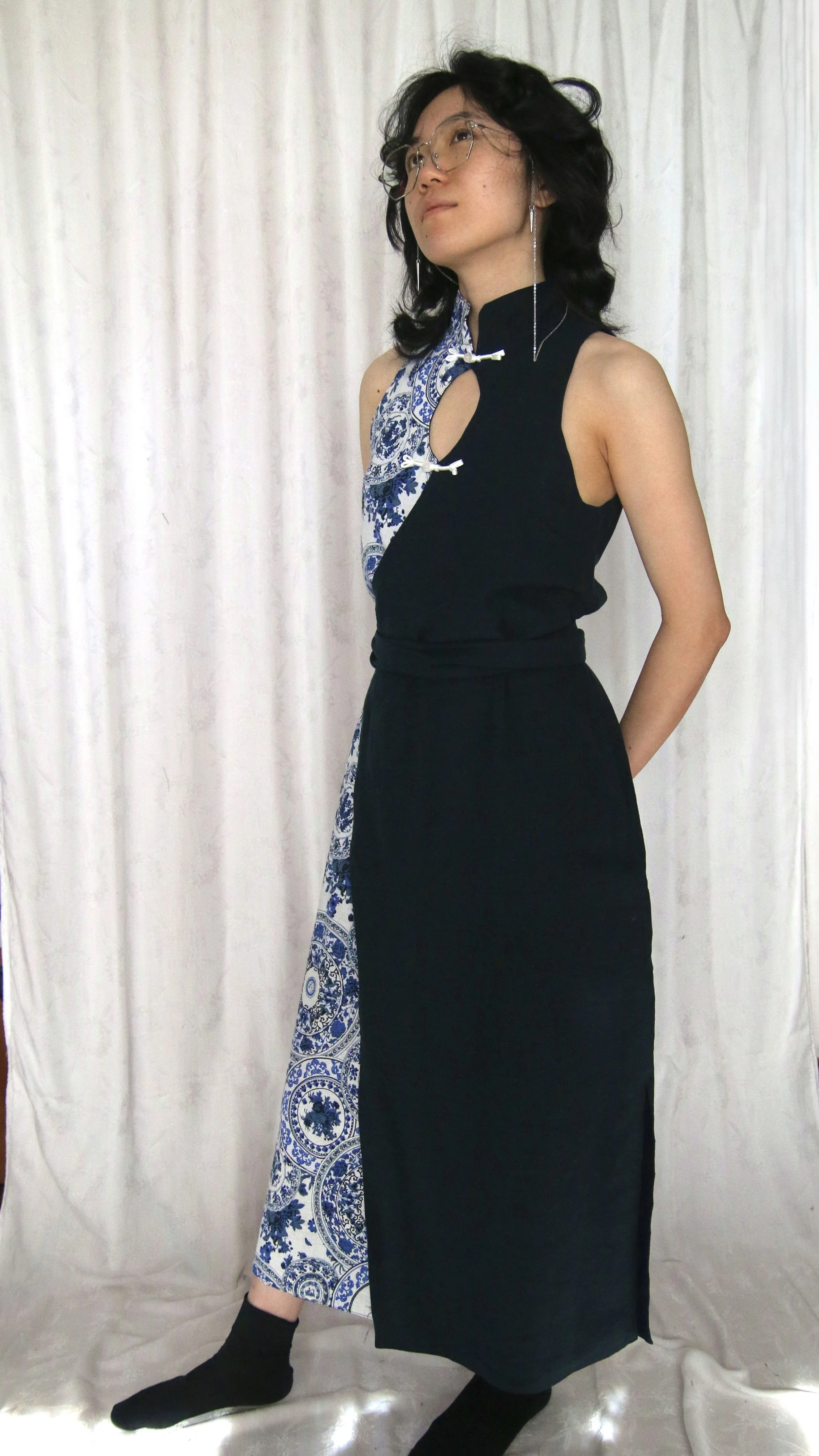 Ilia is wearing the midi-length version of the wrap qipao dress in size S