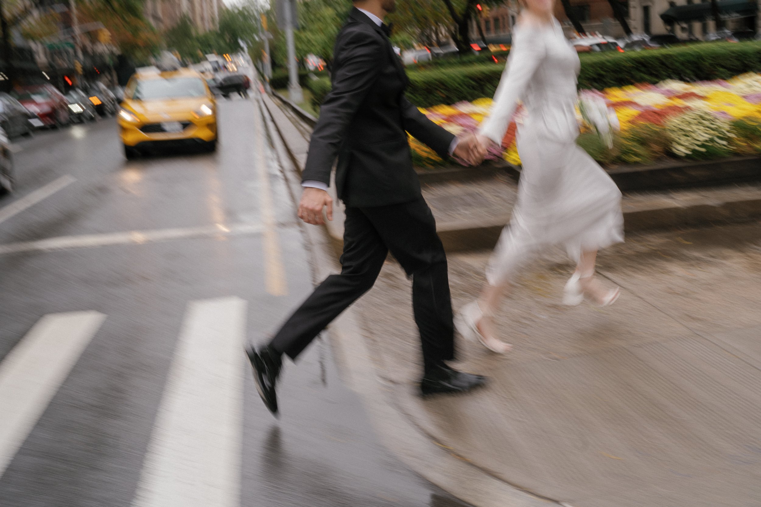 Couple running on Park Ave on the Upper East Side in NYC