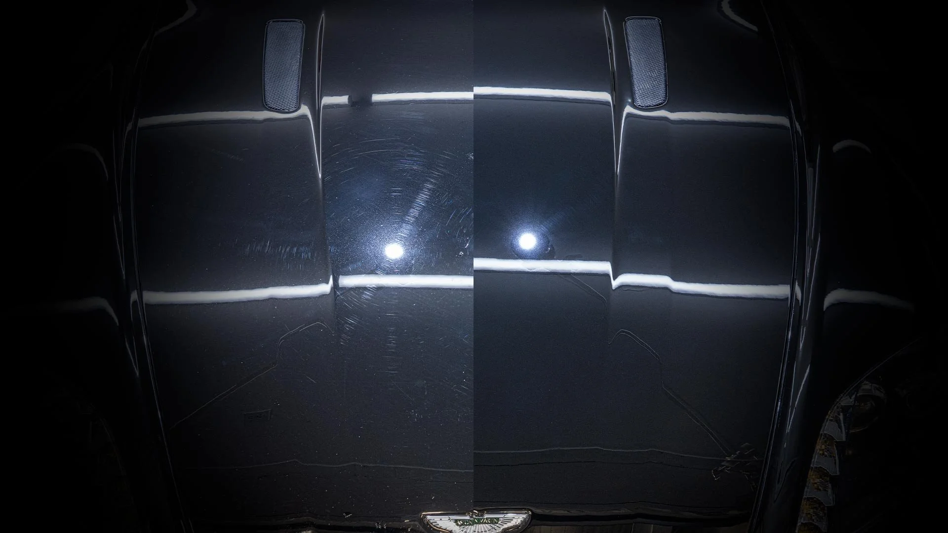 Close-up of a black car's hood showing a comparison of the surface with and without scratches, illuminated by a bright light, highlighting the scratches present on the older surface.