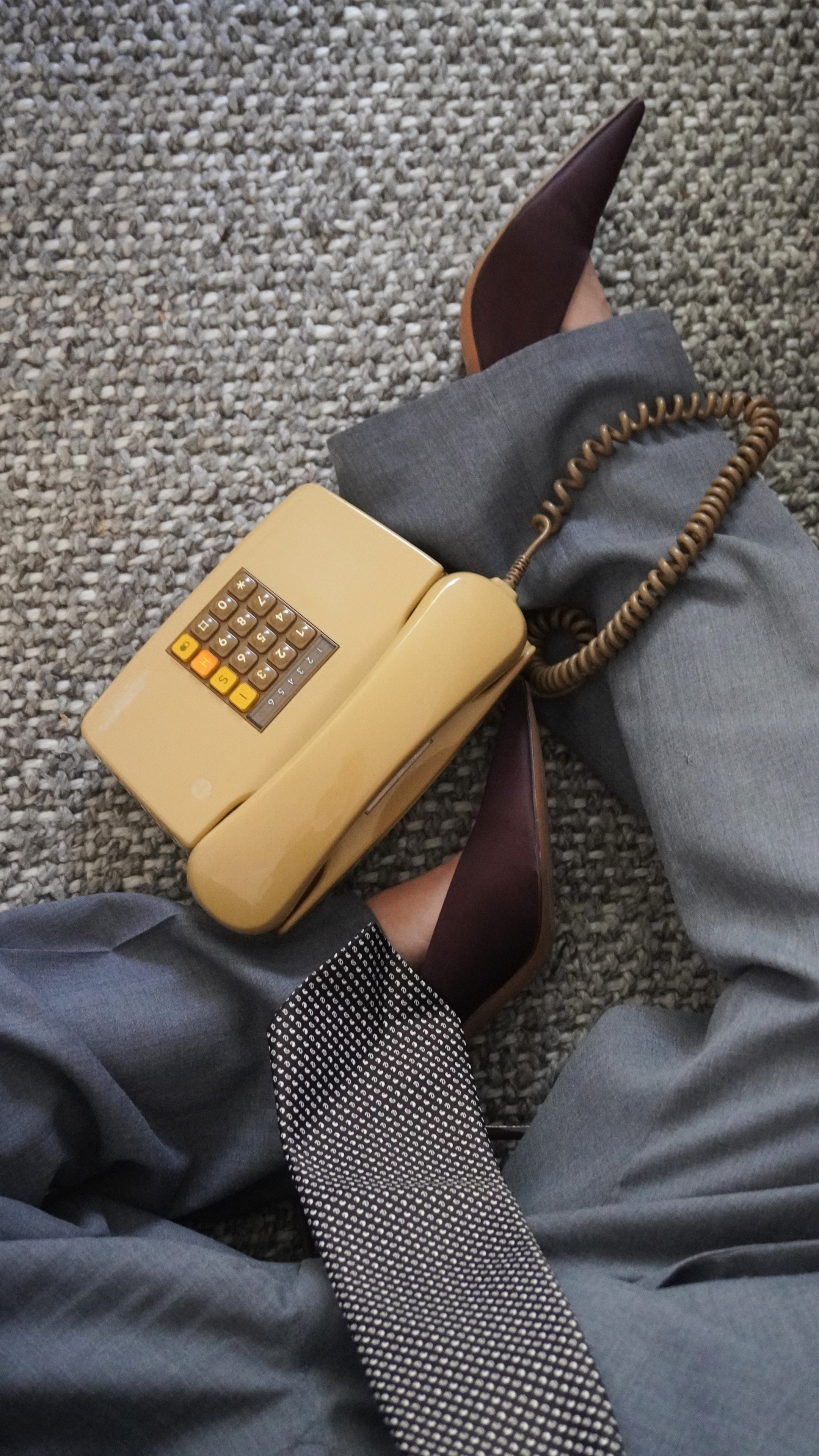 phone, suit. tie, shoes, in the office