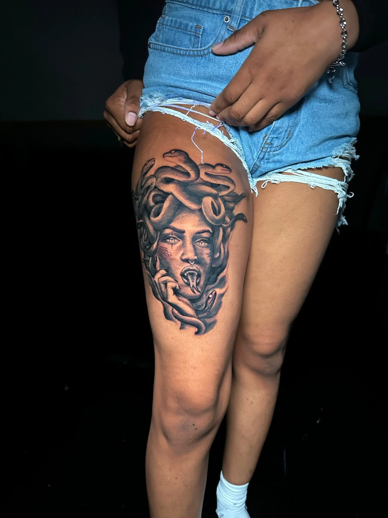 huge tattoo design in the upper leg