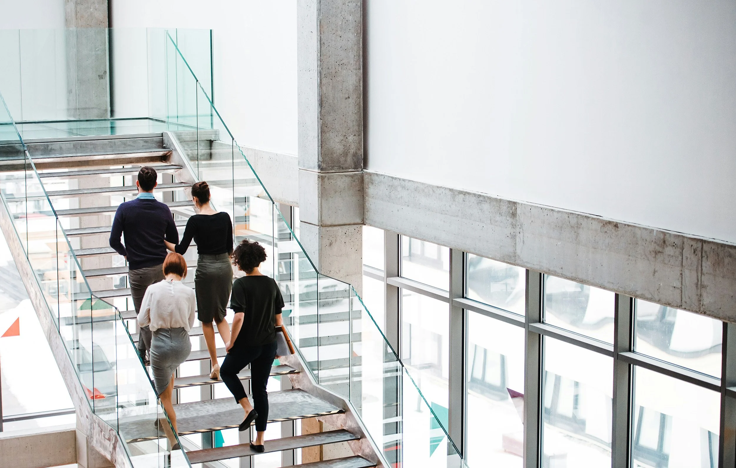 Office workers walking up stairs