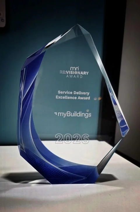 MRI award with blue accents, inscribed with "Revolutionary Award, Service Delivery Excellence Award, 'myBuildings', 2026."