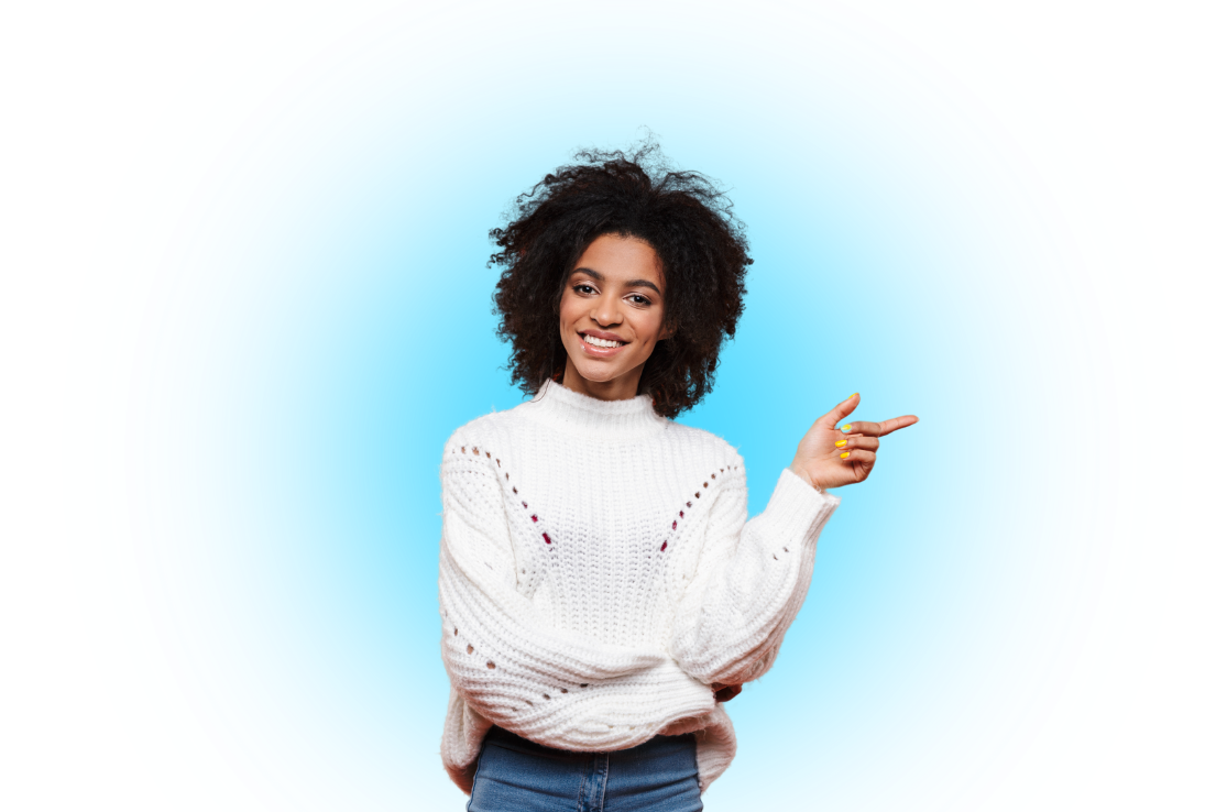 A woman with brown skin in a white knitted sweater smiling and pointing to the right against a blue background