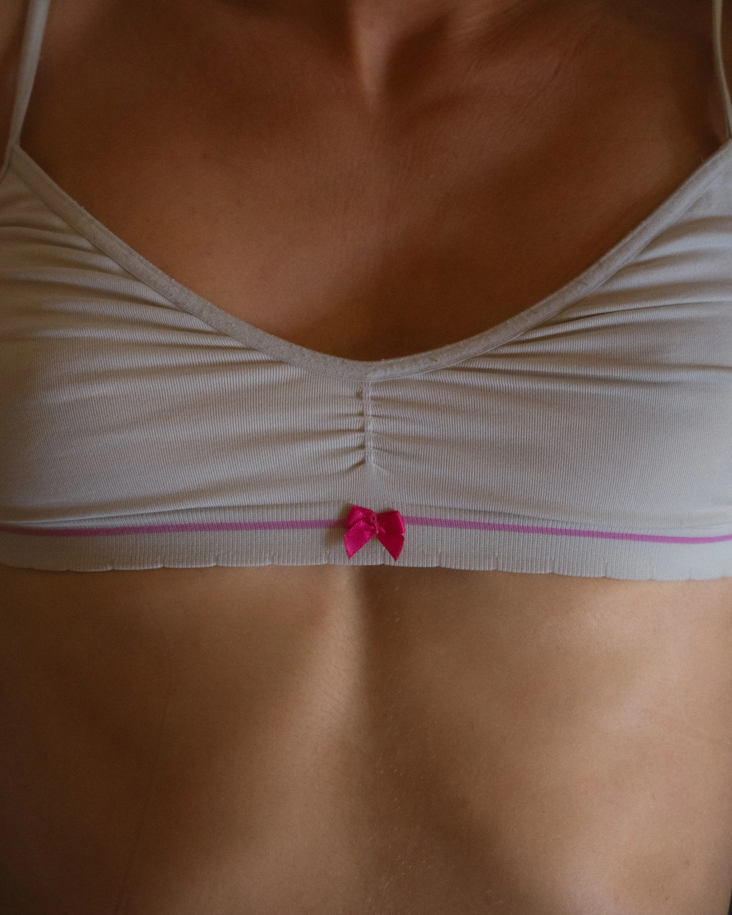 Editorial close-up photograph exploring intimacy and the human body through minimal detail.