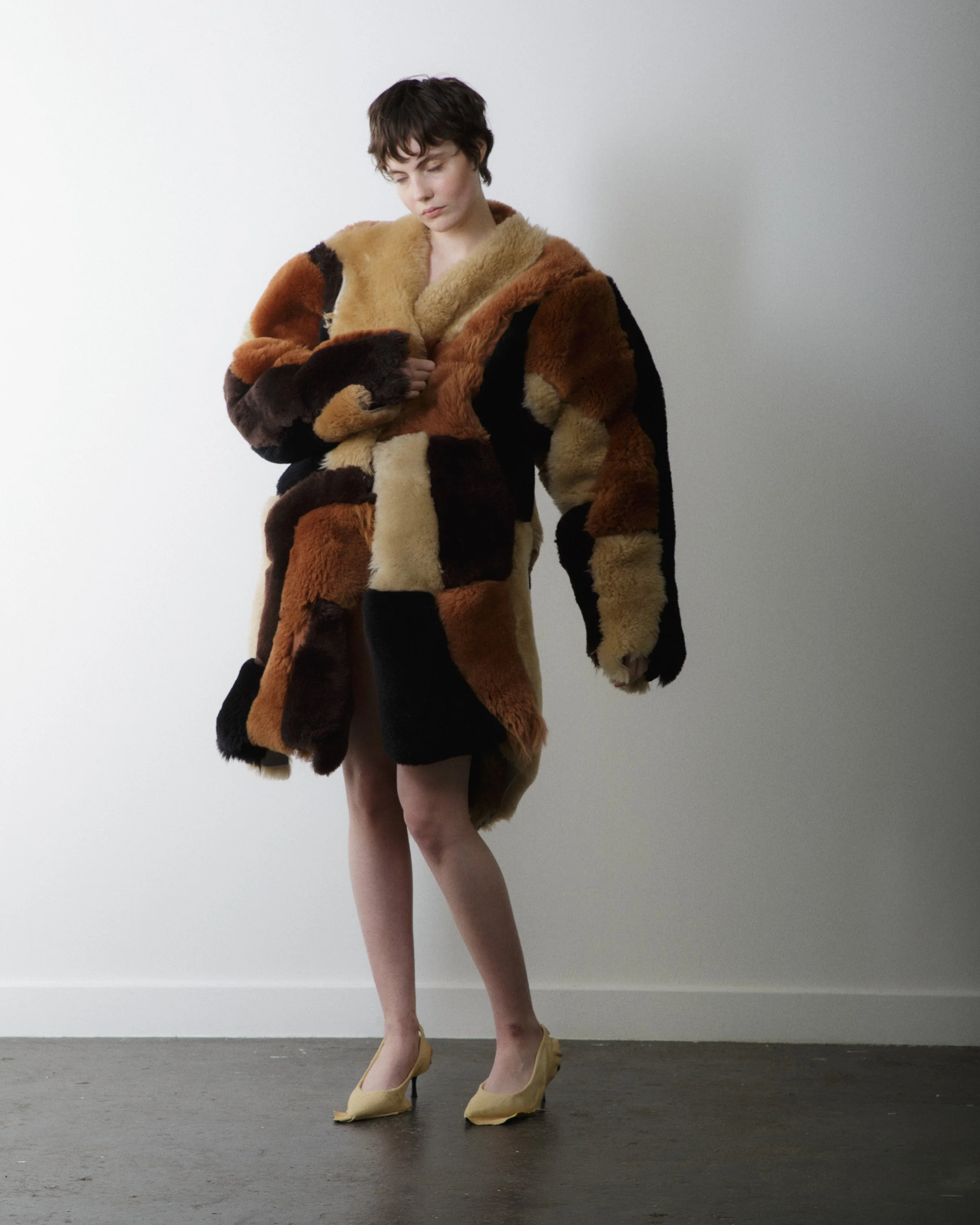 Fashion editorial portrait exploring texture, silhouette, and contrast.