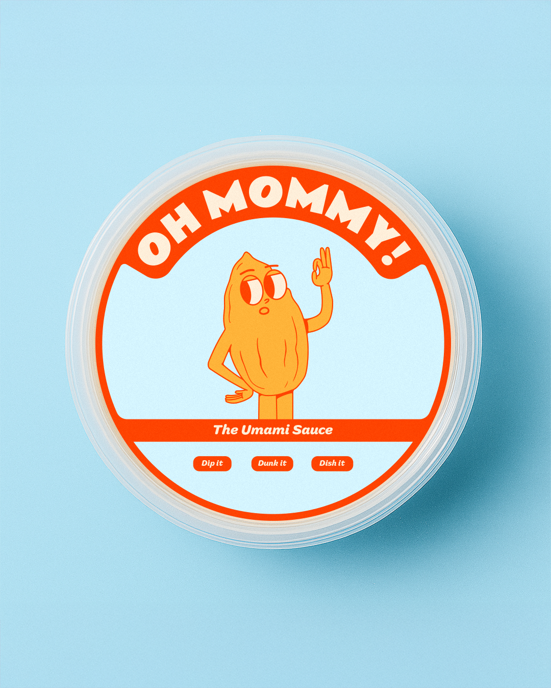 Branded container of umami sauce with cartoon Almond character giving an OK sign, label reads "OH MOMMY!" "The Umami Sauce."