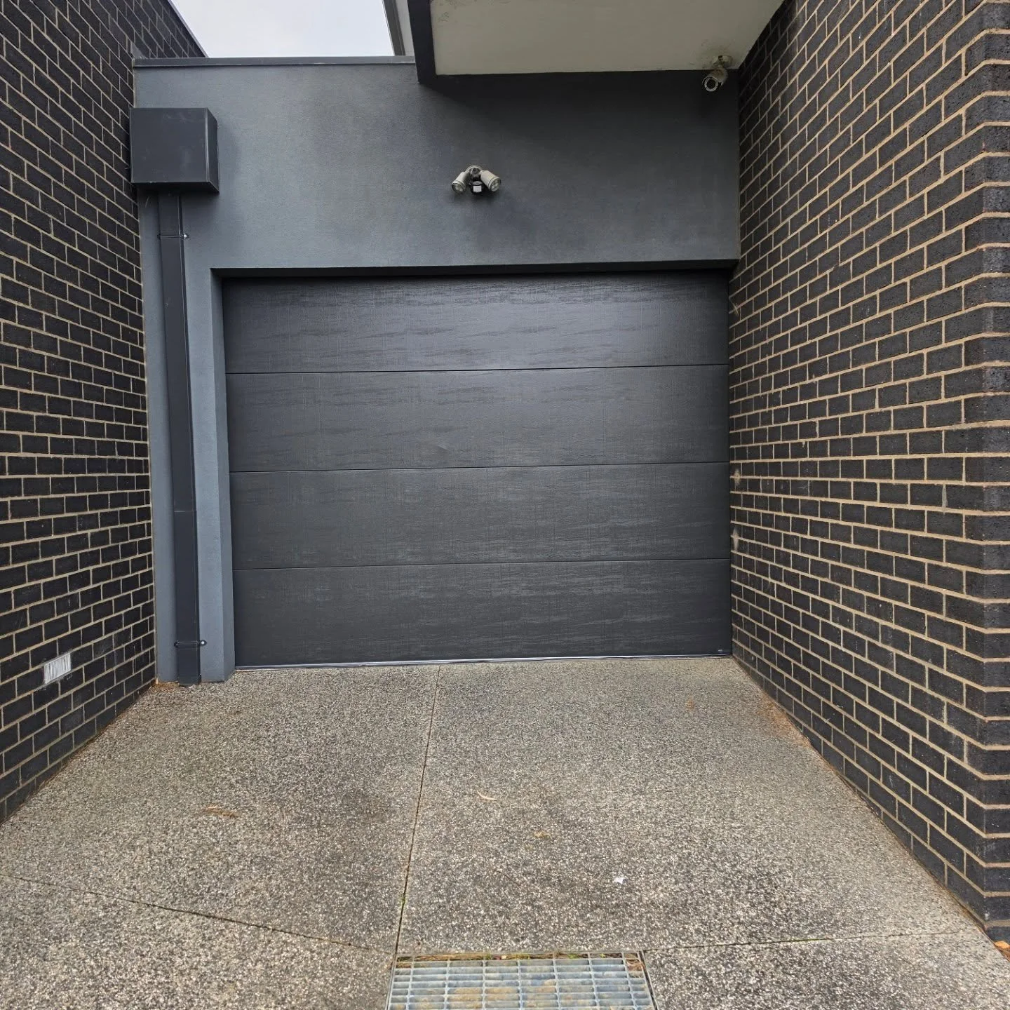 This one came down on the roof of the car and didn't reverse as it should have. Why? Because it was set to maximum force. This put so much pressure on the top panel it folded before our client could push the remote to stop the door. A new door and mo