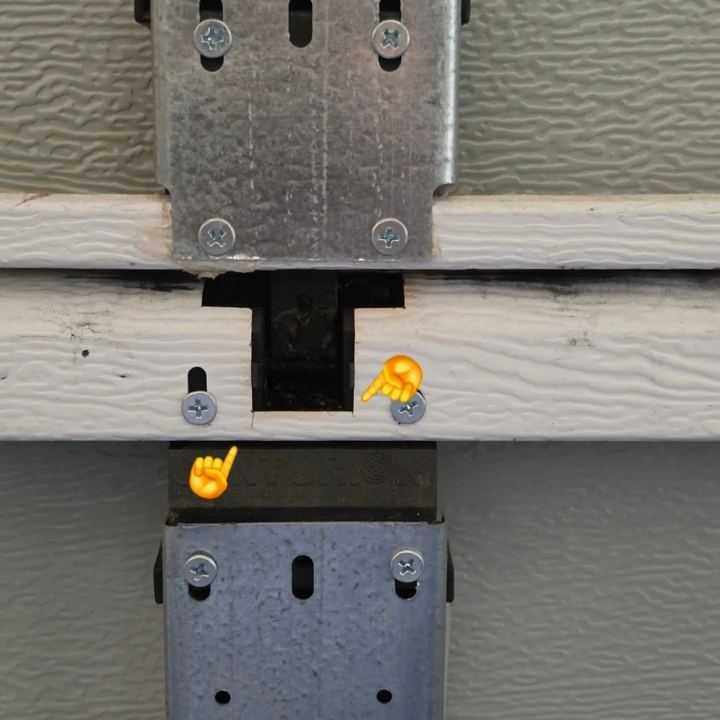 Sectional doors are a fantastic option for a garage door. There are plenty of design options to choose from, and they are extremely serviceable, so they can last a lifetime.

That is, until the panels begin to split in two. This door isnt even 5 year