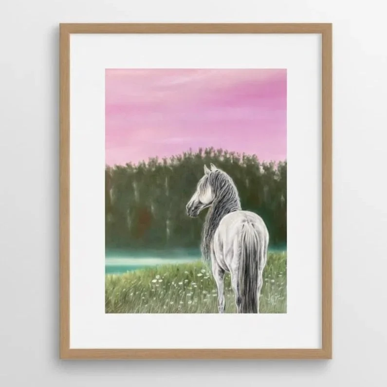 A watercolor painting of a white horse standing in a green field with wildflowers, background of trees and a pinkish sky.