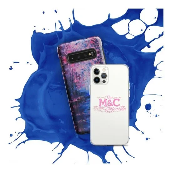 Two smartphones placed on a blue paint splash background. One phone has a colorful, textured case with pink, purple, and blue hues, while the other has a white case with pink text reading 'The M&C Collection'.